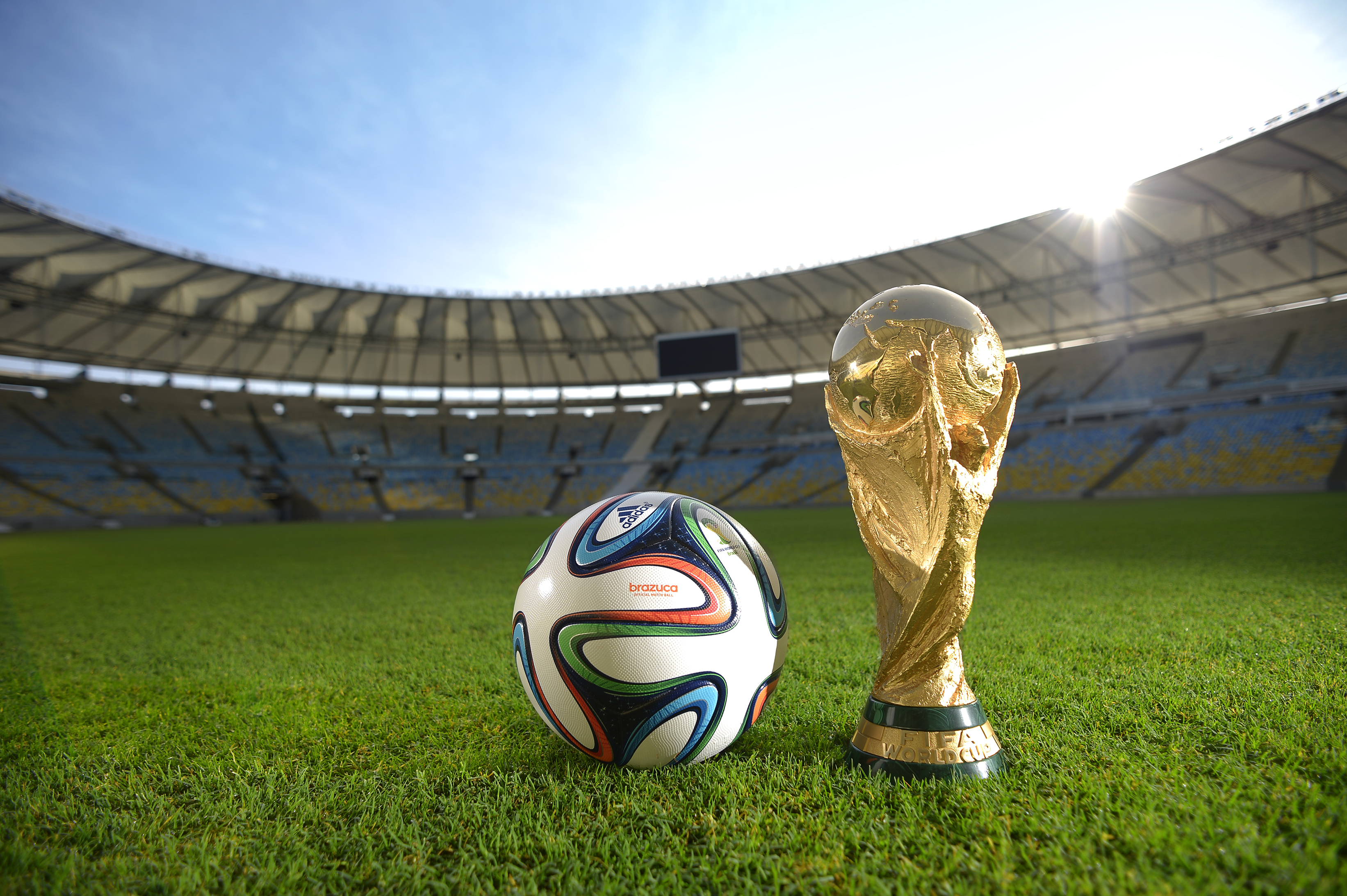 The World Cup Trophy and Brazuca ball