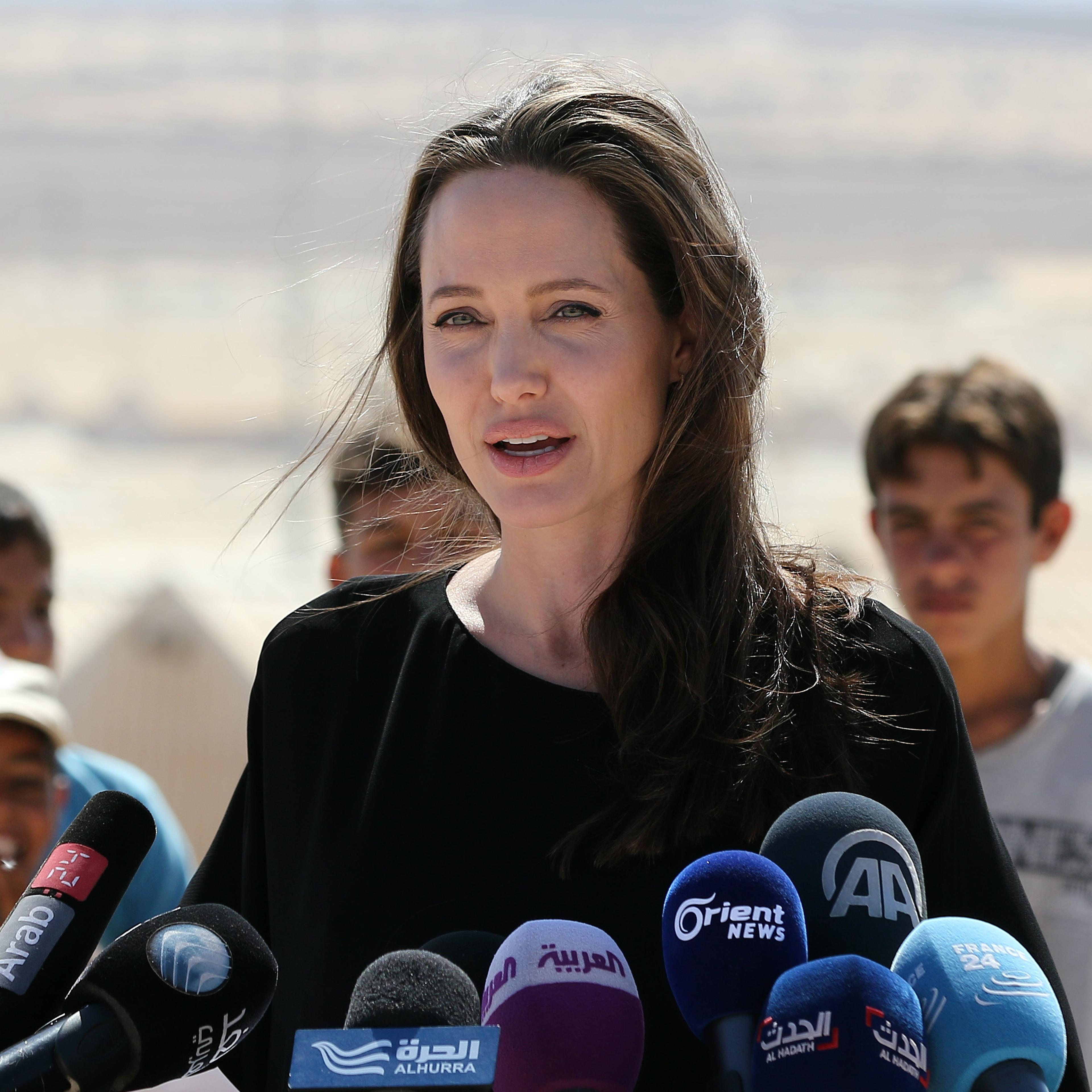 Actress and UNHCR special envoy Angelina Jolie talks during a visit to a Syrian refugee camp in Azraq in northern Jordan, on Sept. 9, 2016.