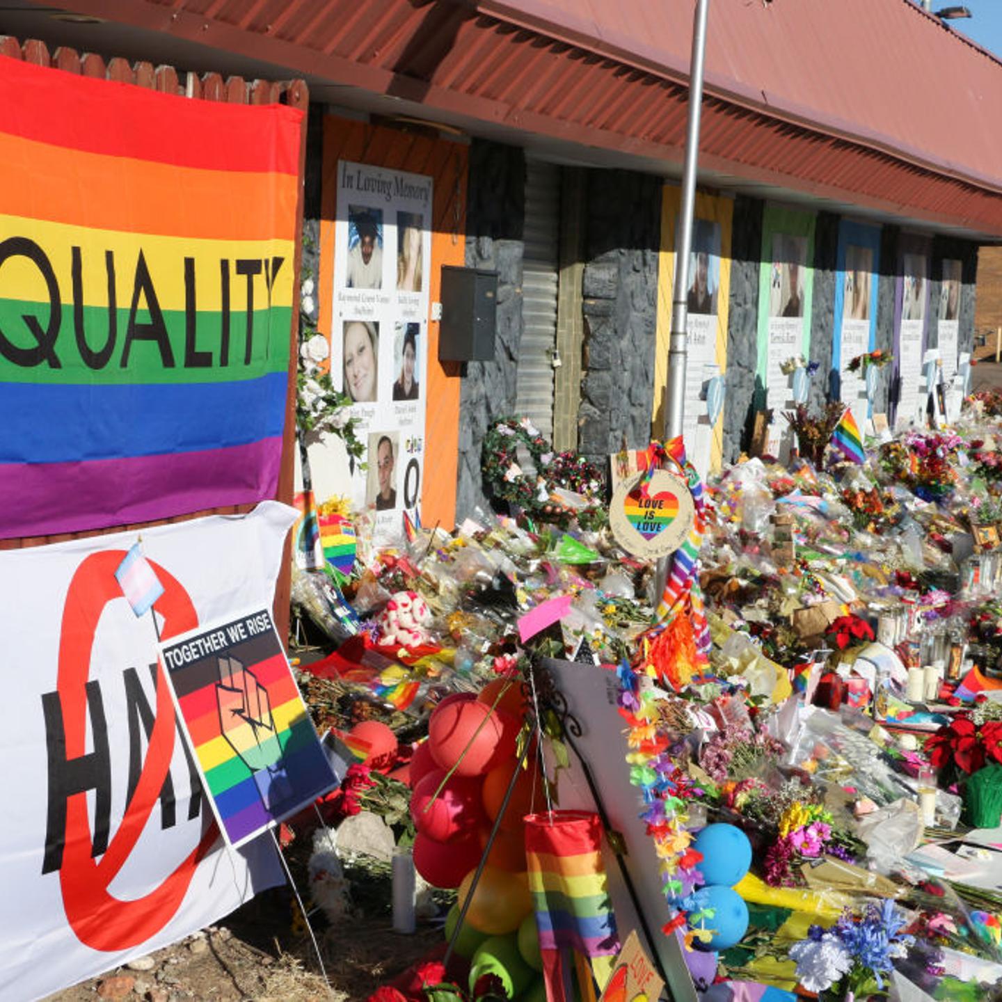 A pride flag reading "Equality" and hundreds of items adorn the closed entrance of an LGBTQ club.