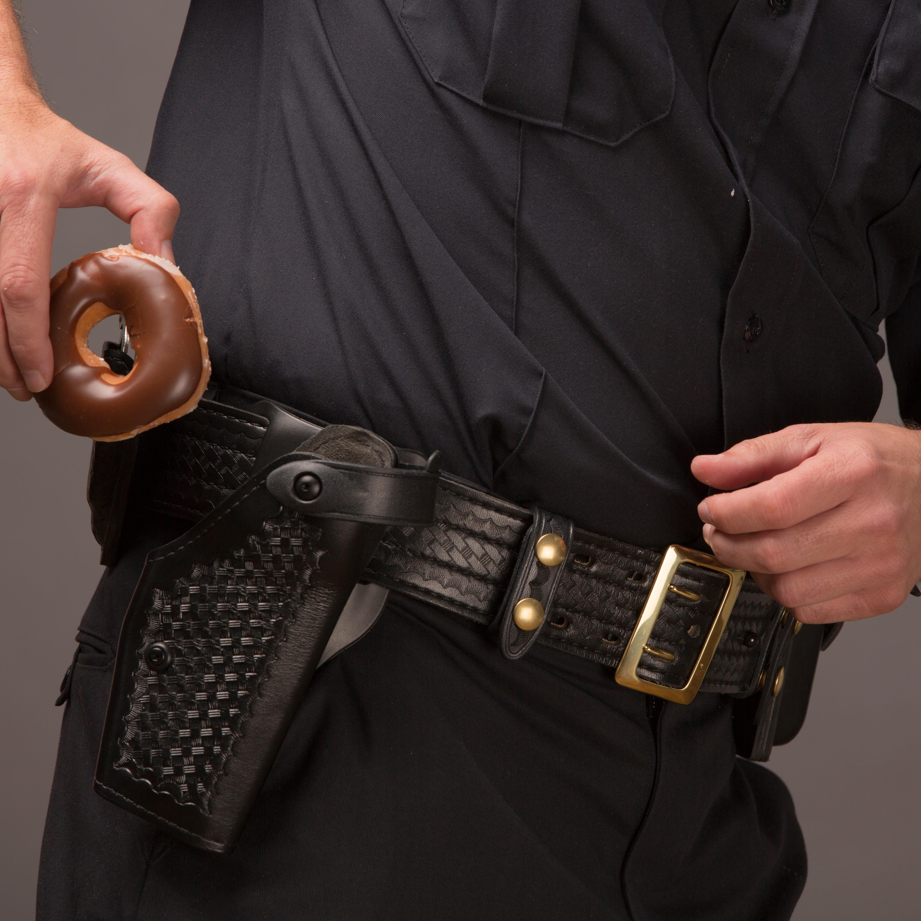Policeman Drawing A Doughnut From Holster