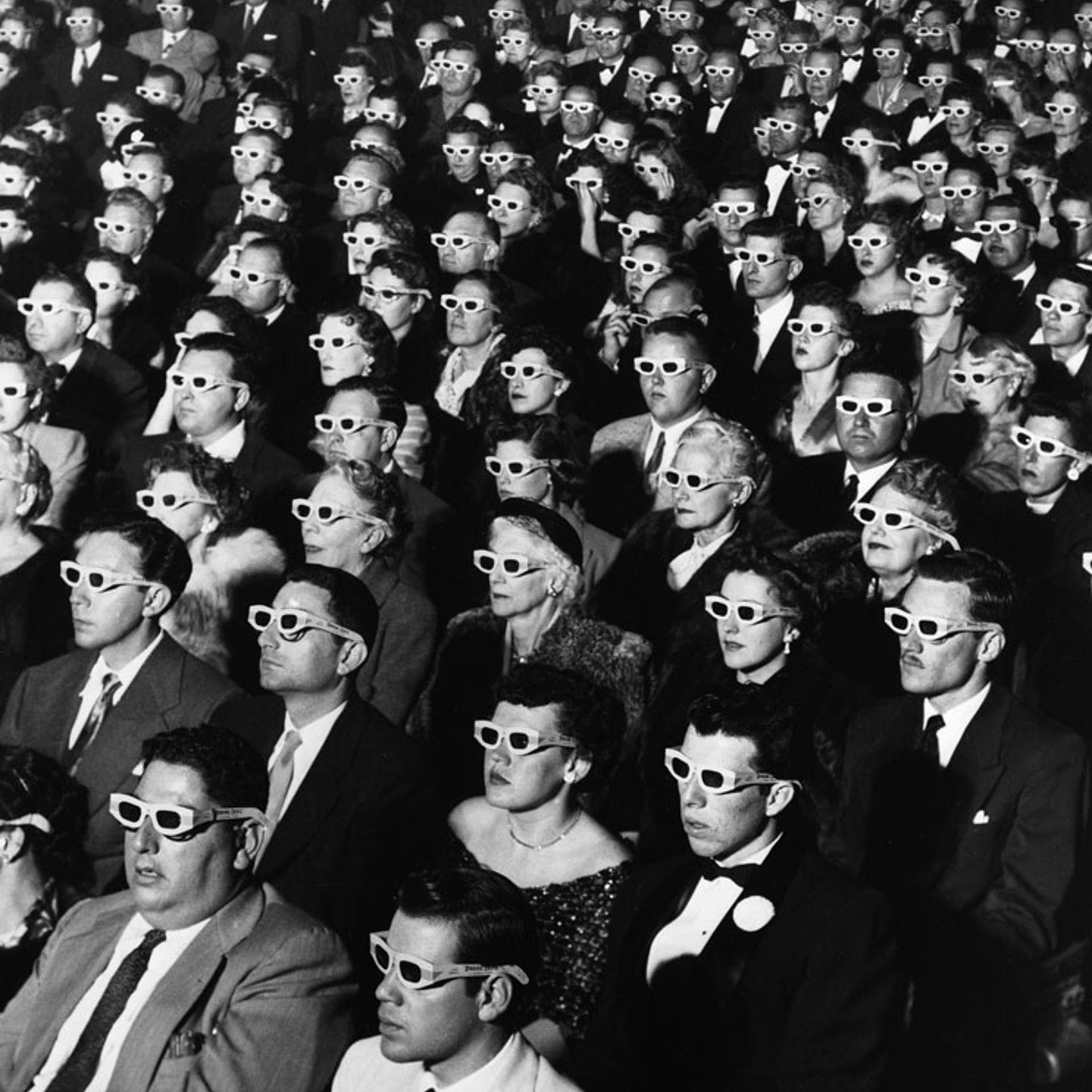 Audience members sport 3-D glasses during the first screening of "Bwana Devil," the first full-length, color 3-D movie, November 26, 1952, at the Paramount Theater in Hollywood.