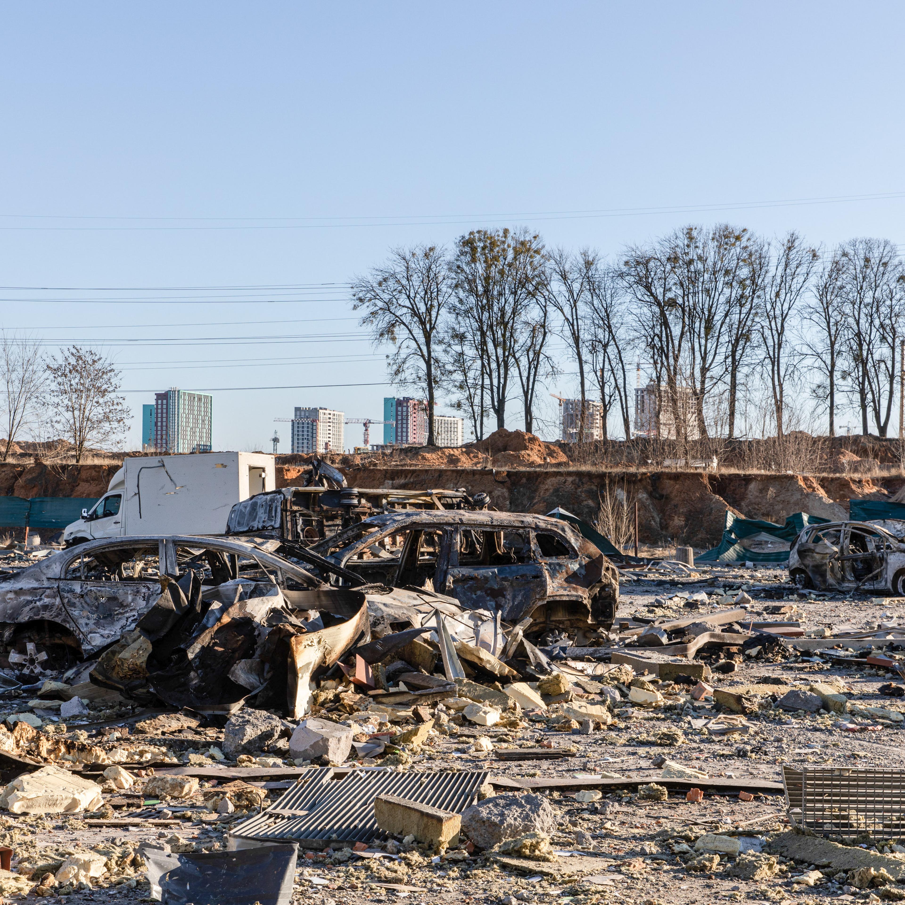 Destroyed cars seen at a bomb site in Kyiv. Amid Russia's