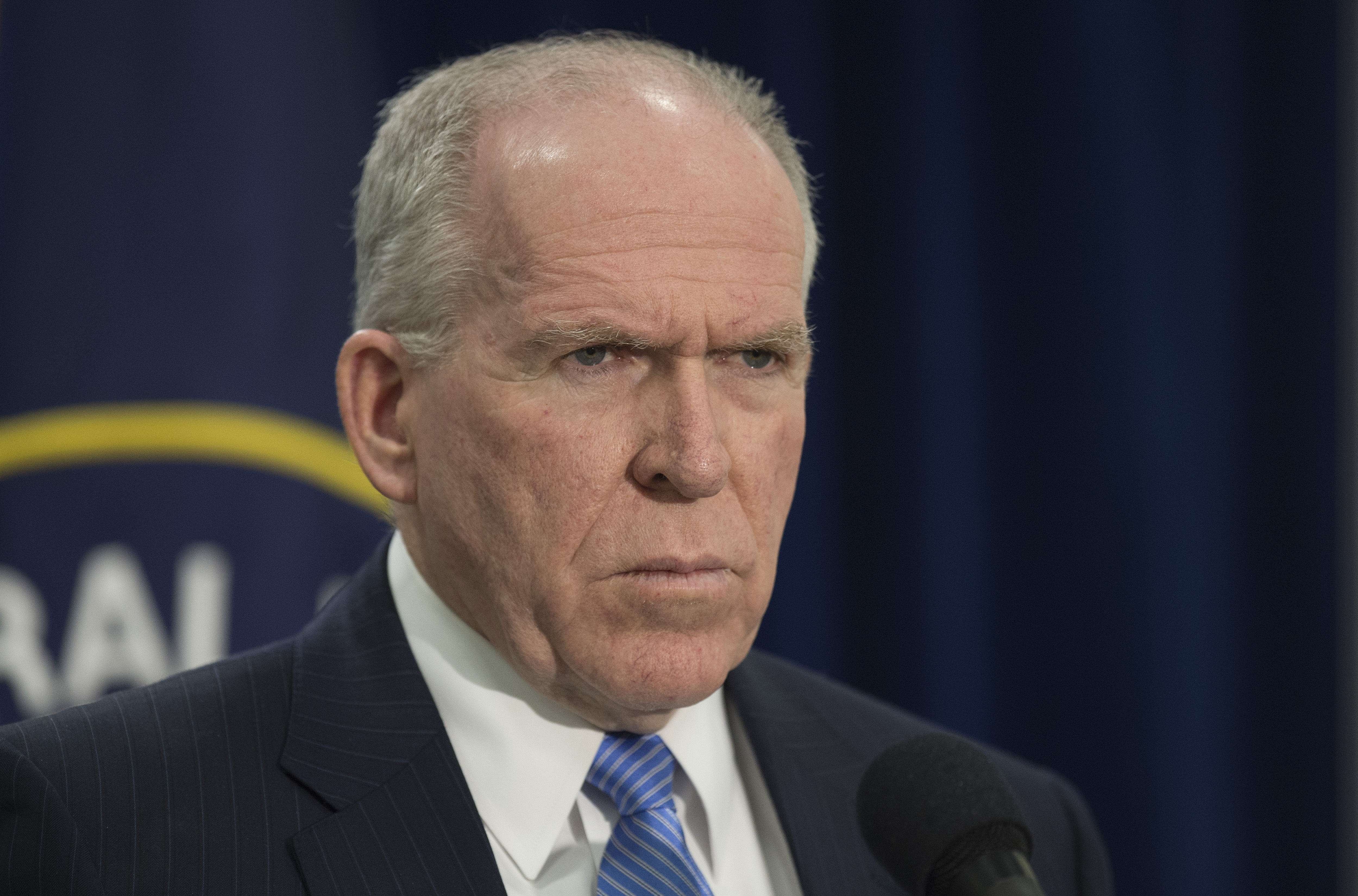 Director of Central Intelligence Agency John Brennan takes questions from reporters during a press conference at CIA headquarters in McLean, Va. on Dec. 11, 2014.