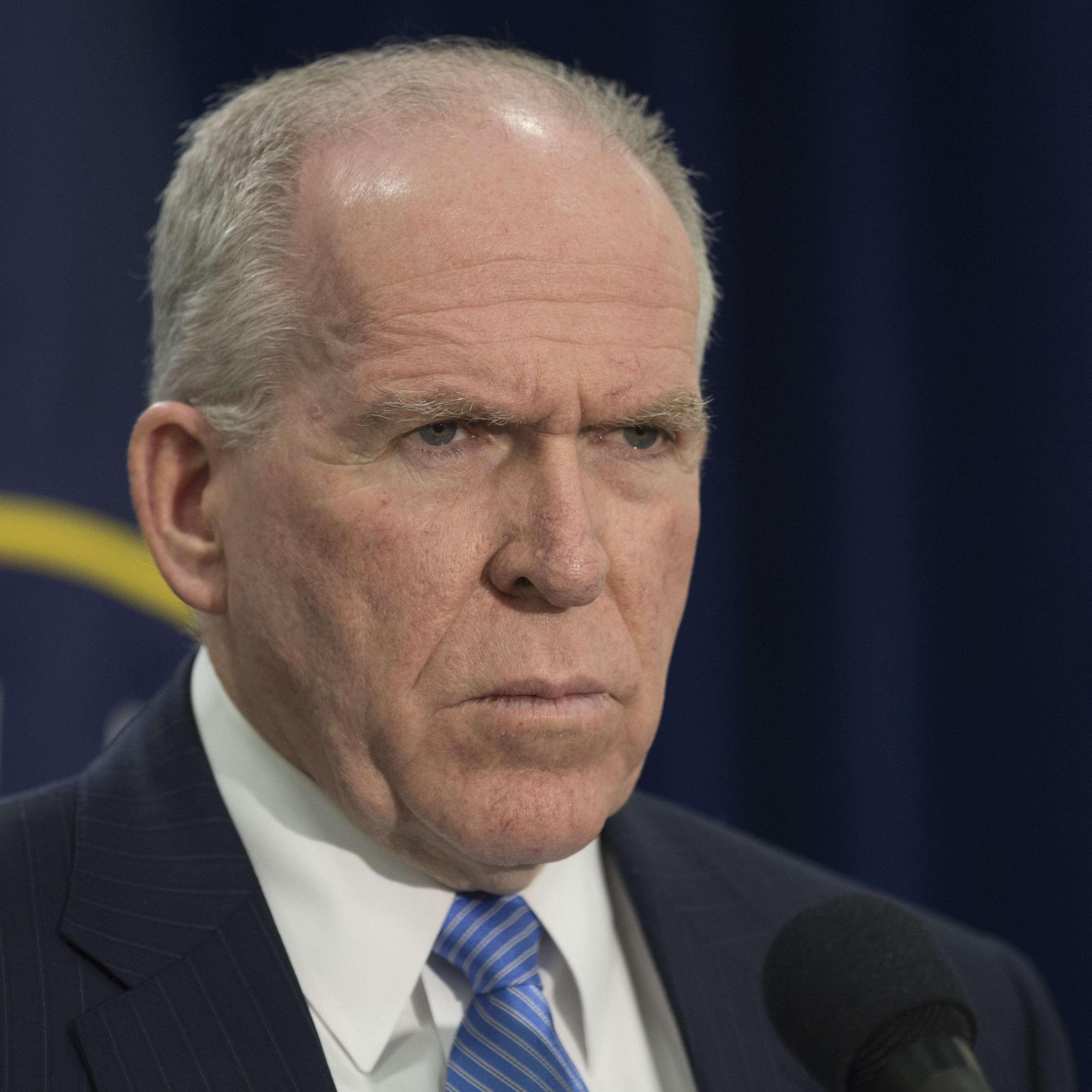 Director of Central Intelligence Agency John Brennan takes questions from reporters during a press conference at CIA headquarters in McLean, Va. on Dec. 11, 2014.