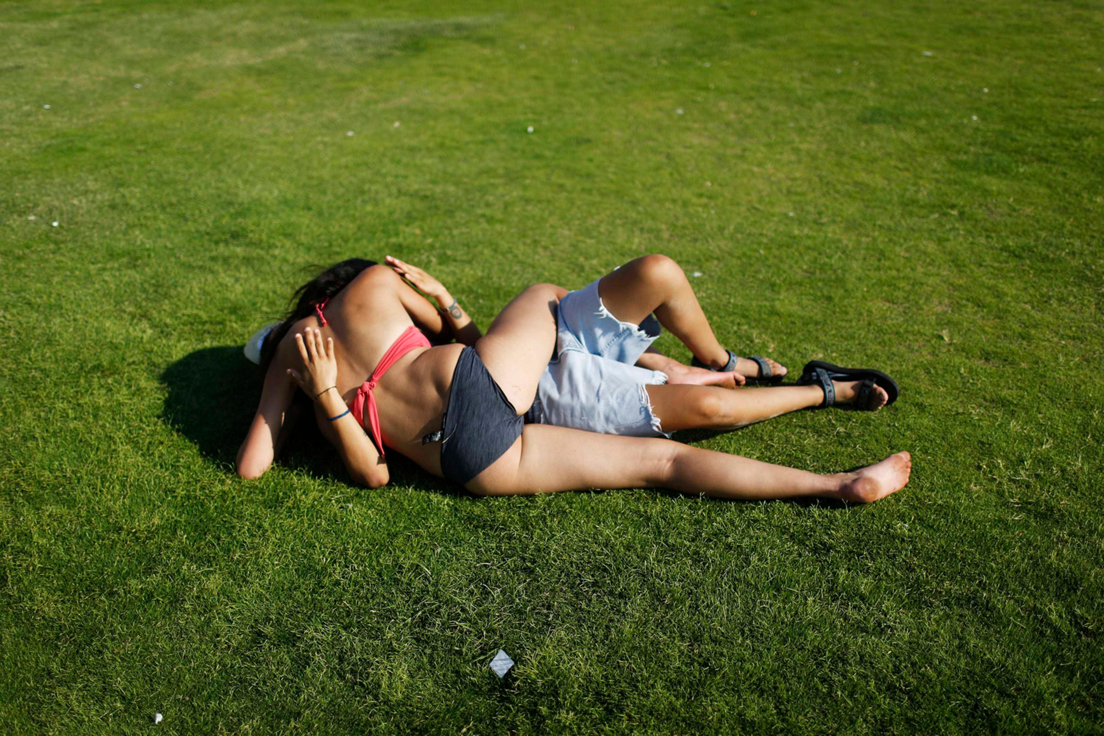 Women kiss during the annual gay pride parade in Tel Aviv