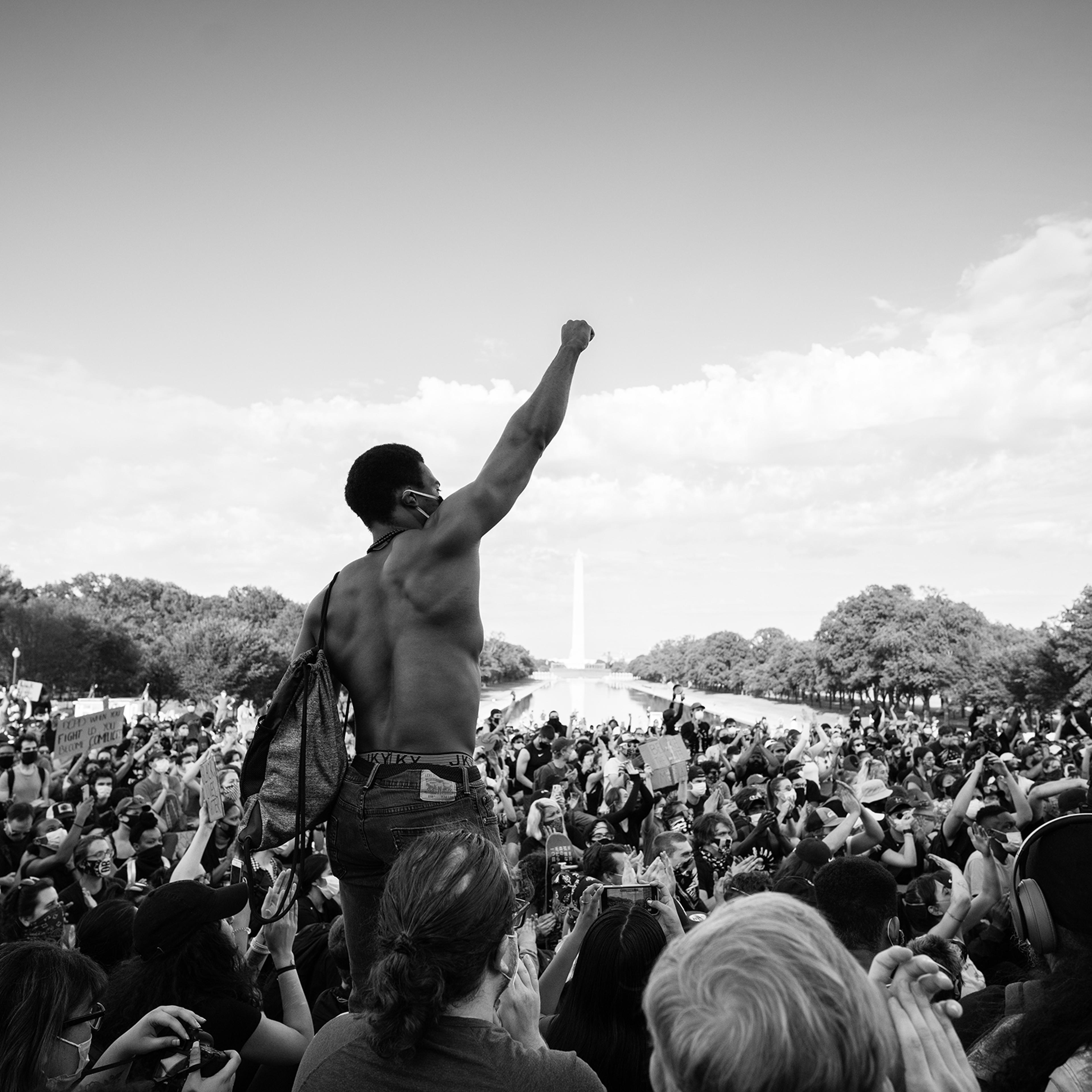 Protester Ismail Bronson raises his fist at a peaceful demonstration at the Lincoln Memorial in Washington, D.C., on June 2, eight days after George Floyd’s killing.