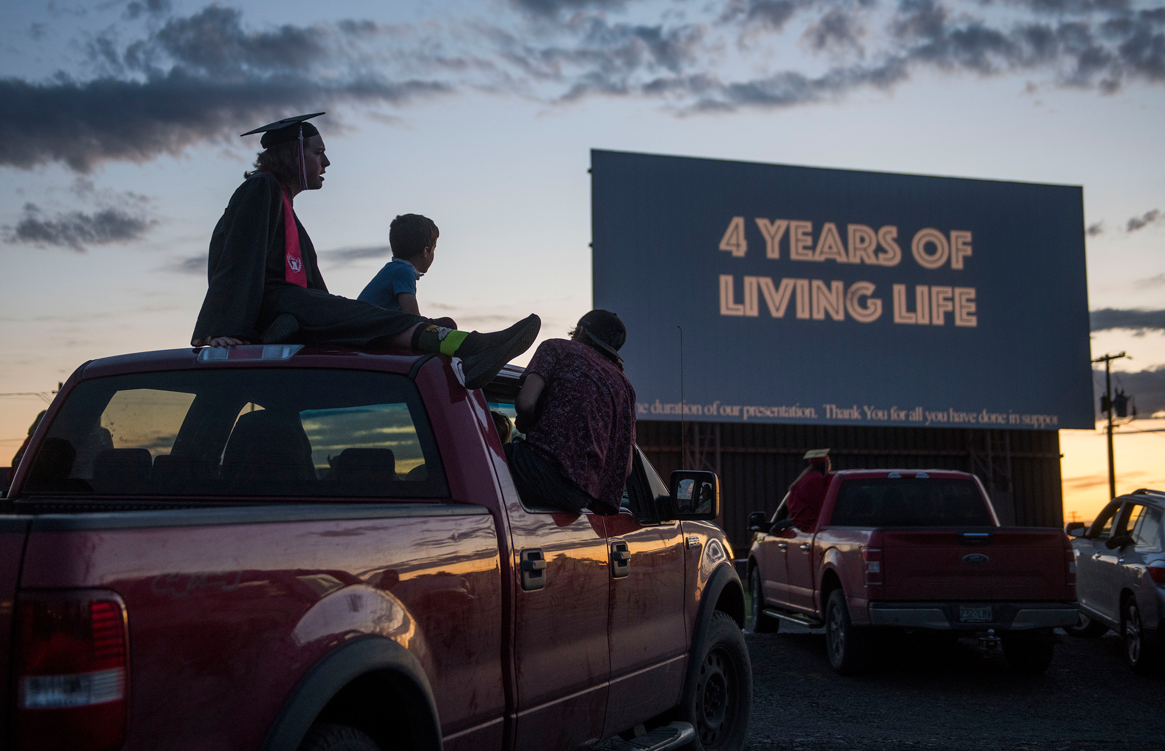 Cameron Curtindale, left, at a ceremony with Weston-McEwen High School classmates at the M-F Drive-In Theater in northern Oregon