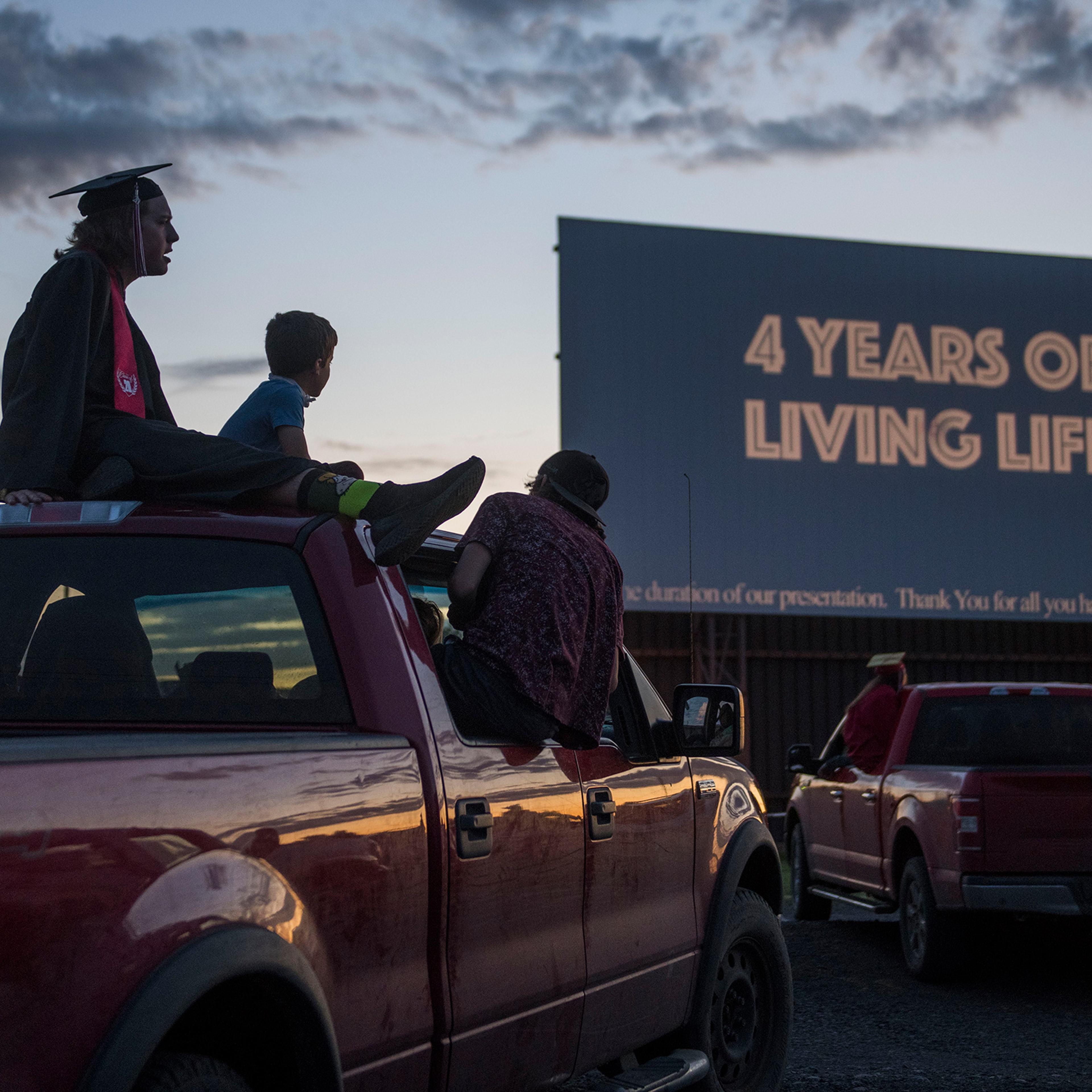 Cameron Curtindale, left, at a ceremony with Weston-McEwen High School classmates at the M-F Drive-In Theater in northern Oregon