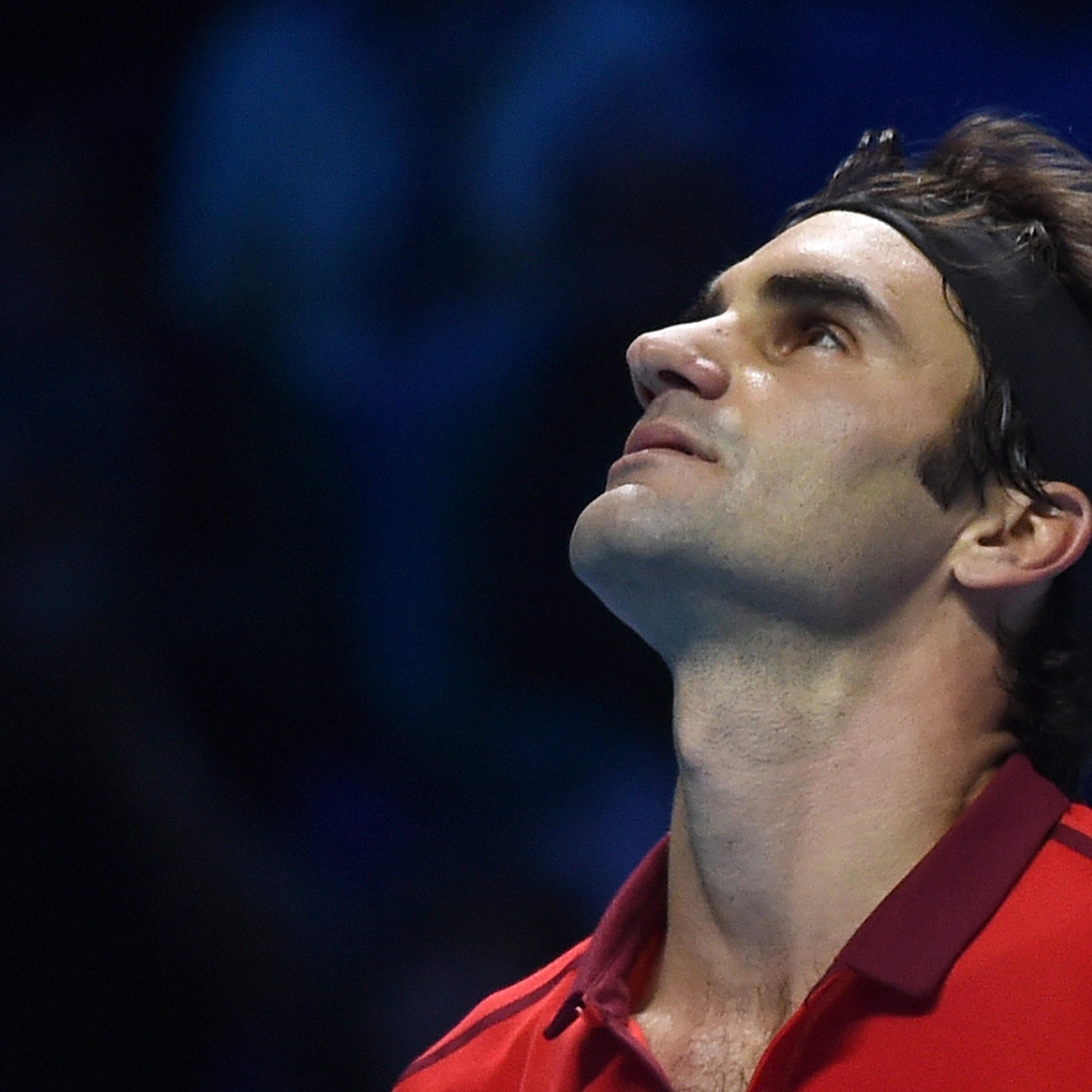 Roger Federer looks up during his singles ATP World Tour Finals semifinal tennis match against Switzerlands Stan Wawrinka at the O2 Arena in London on Nov. 15, 2014.