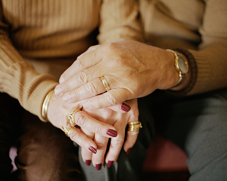 Couple holding hands