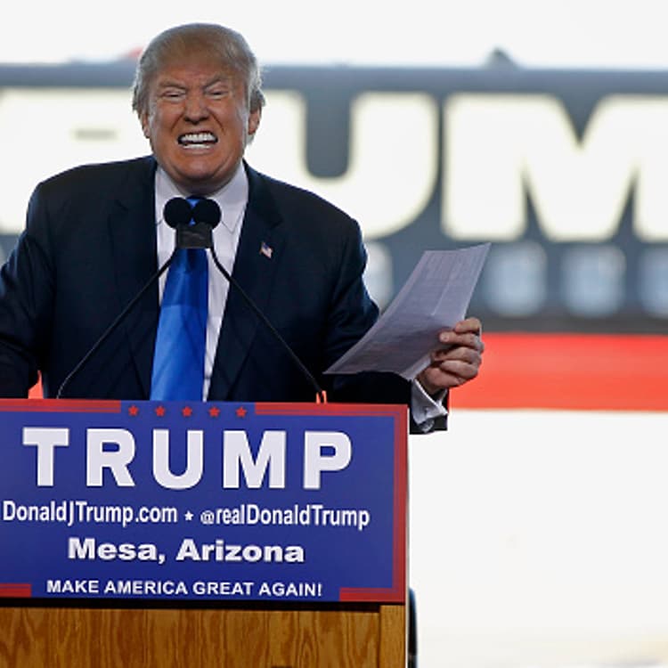 Republican presidential candidate Donald Trump speaks to guests gathered during a campaign event at the International Air Response facility on December 16, 2015 in Mesa, Arizona.