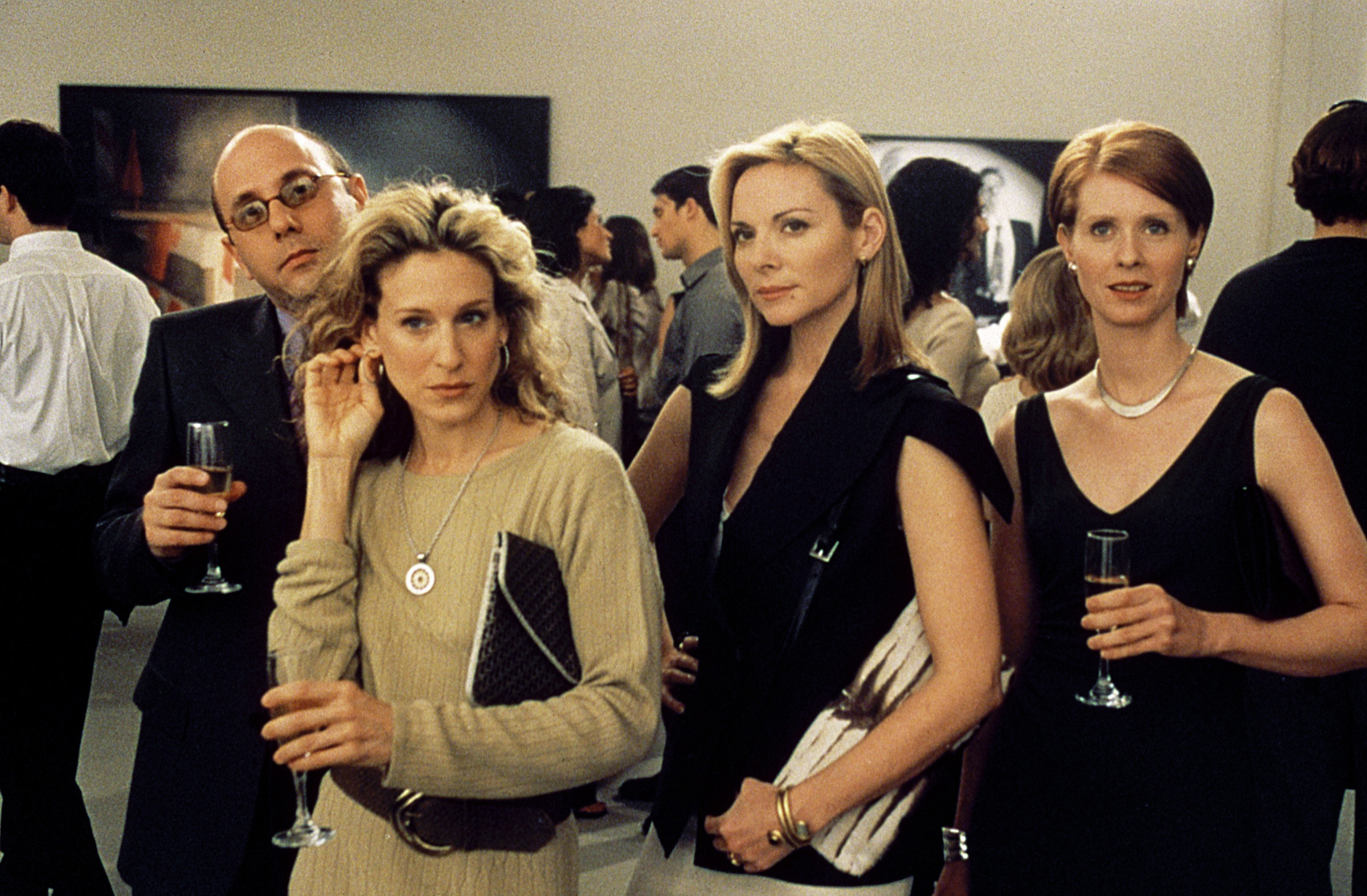Kim Cattrall, center, alongside Willie Garson, Cynthia Nixon, and Sarah Jessica Parker in Sex and the City, Season 3, Episode "Boy Girl Boy Girl."