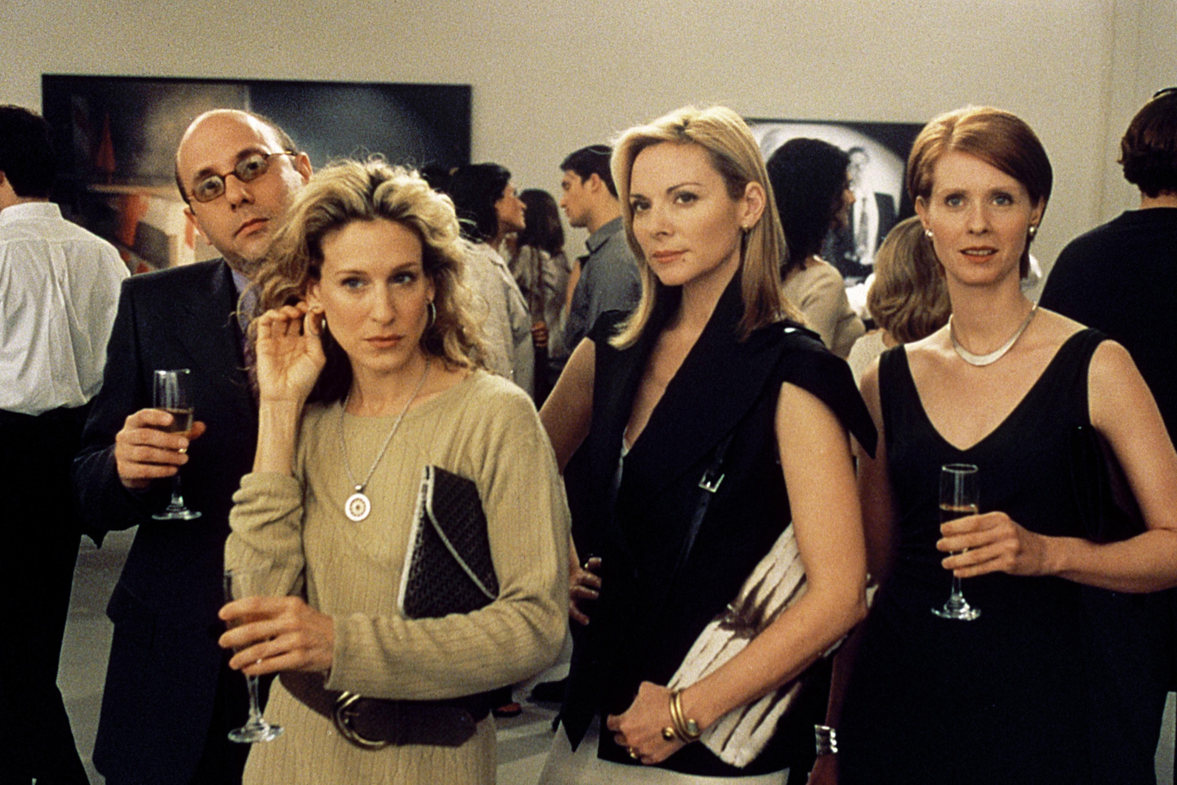 Kim Cattrall, center, alongside Willie Garson, Cynthia Nixon, and Sarah Jessica Parker in Sex and the City, Season 3, Episode "Boy Girl Boy Girl."