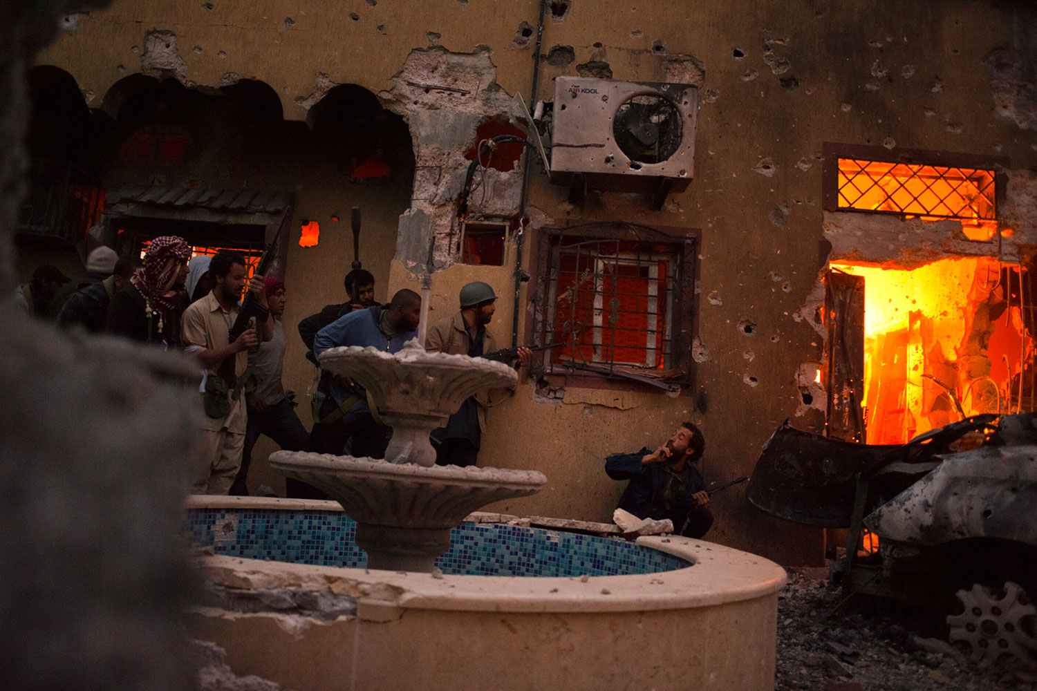 April 24, 2011. Rebels preparing to invade a house occupied by government soldiers in downtown Misurata. 