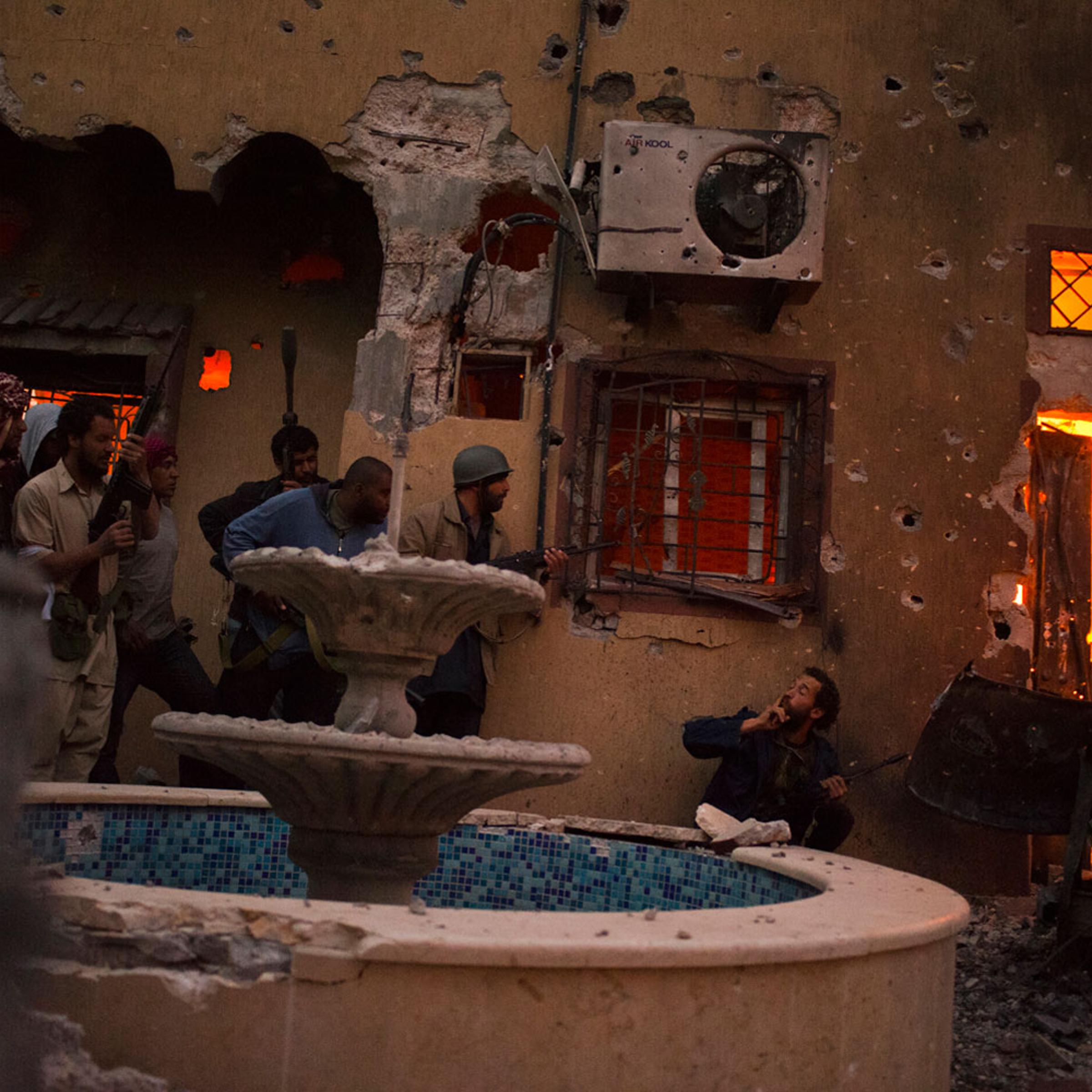 April 24, 2011. Rebels preparing to invade a house occupied by government soldiers in downtown Misurata.