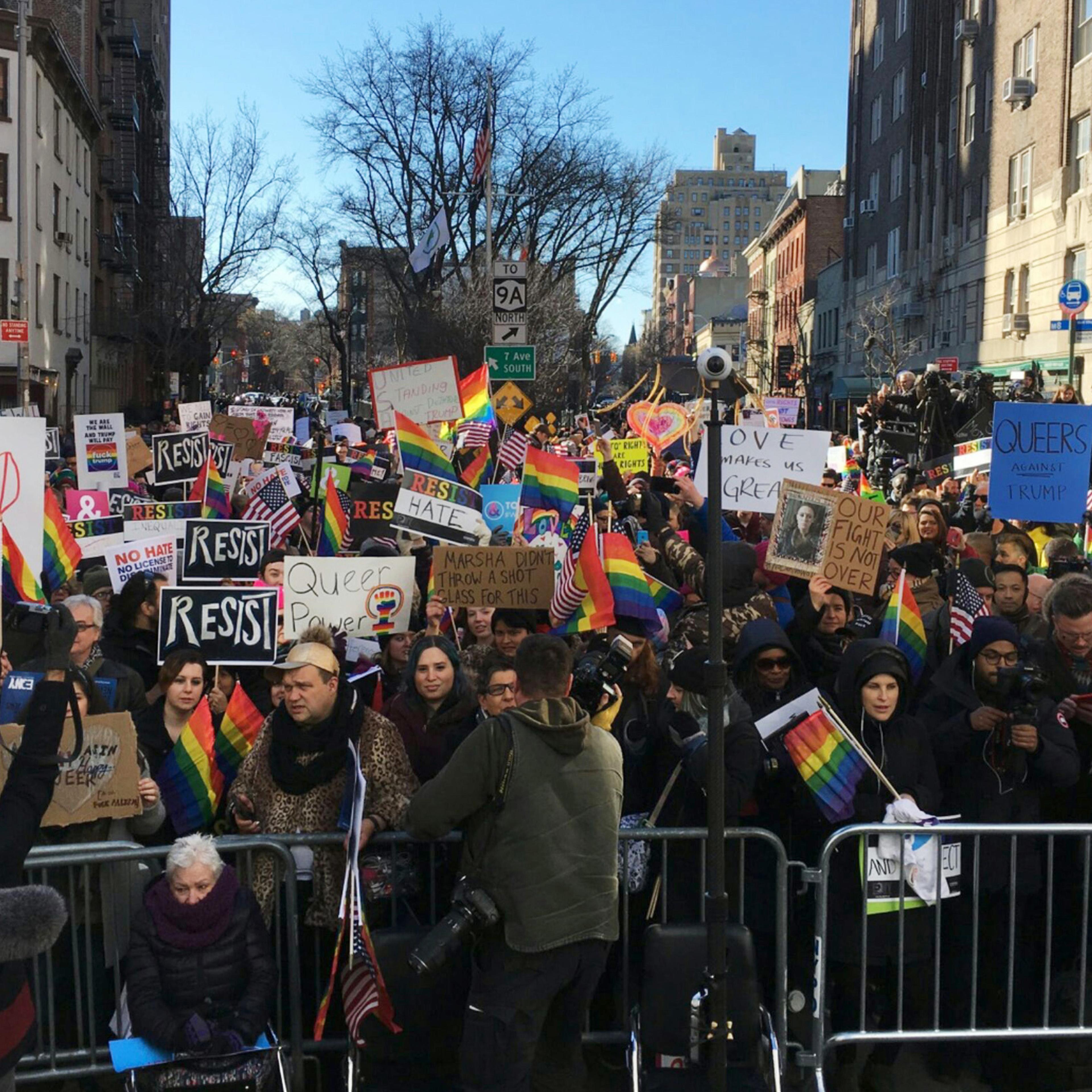Protesters opposed to President Donald Trump's Immigration policy gather outside the Stonewall Inn, a Greenwich Village bar where the gay rights movement was born, Saturday, Feb. 4, 2017. One week before, the president issued an executive order barring p