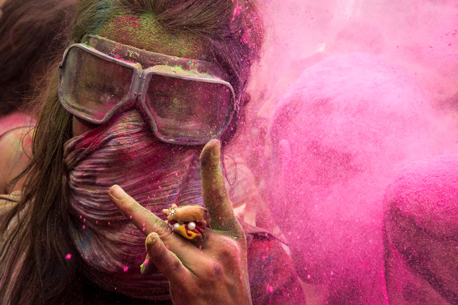 July 29, 2012. A woman gestures during the Holi festival in Berlin.