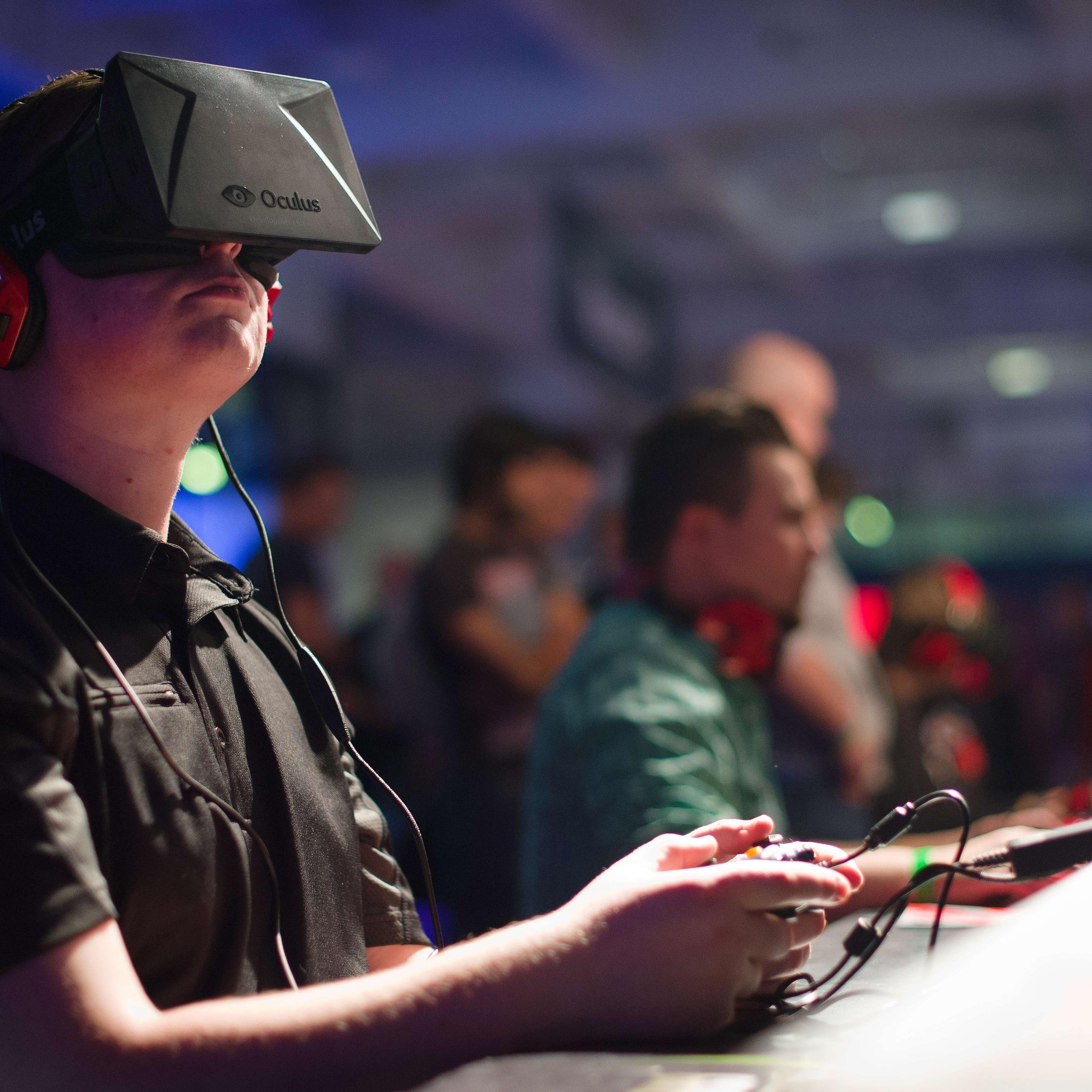 A gamer uses an Oculus virtual reality headset at the Eurogamer Expo 2013 in London.