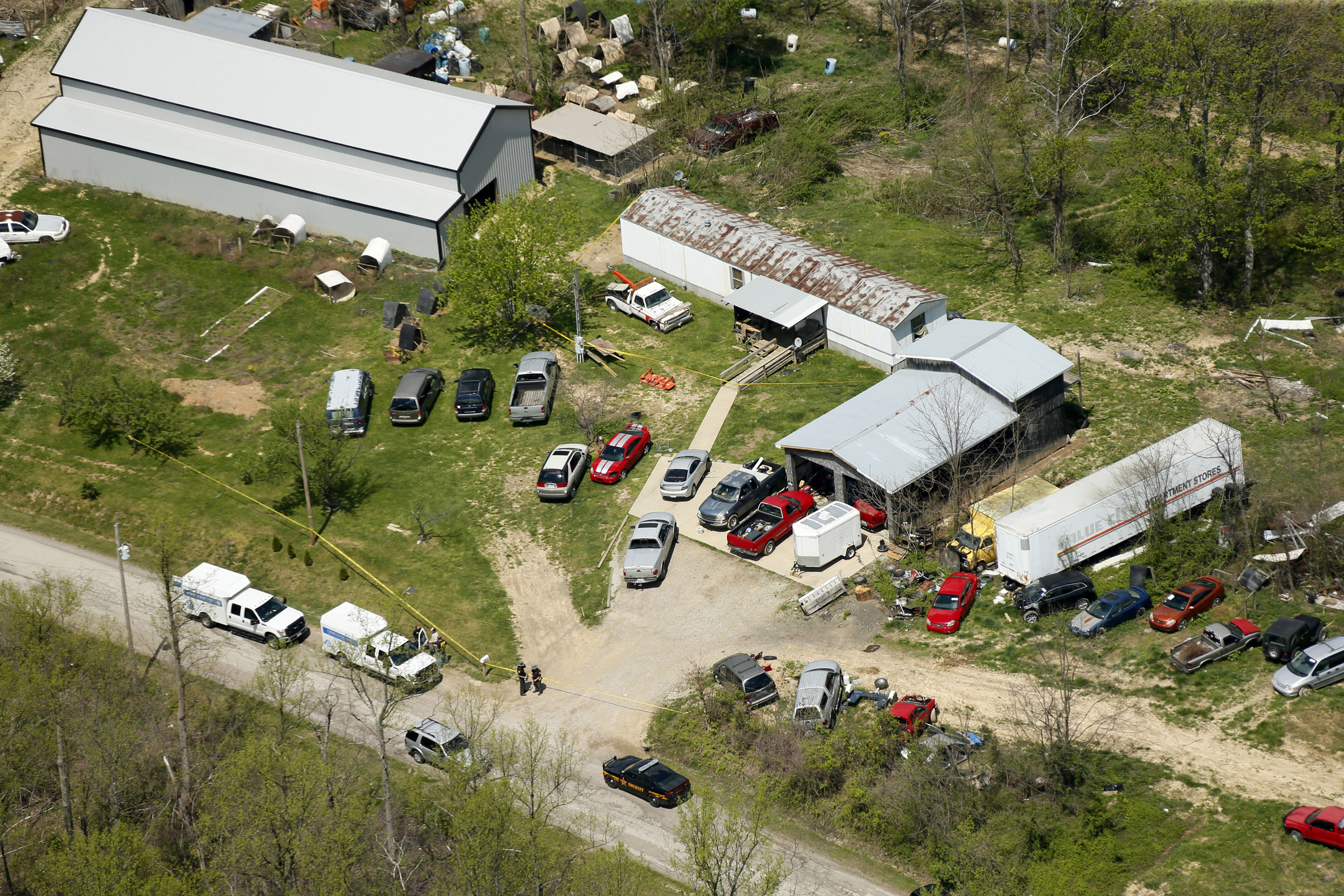 This aerial photo shows one of the locations being investigated in Pike County, Ohio, as part of an ongoing homicide investigation, Friday, April 22, 2016. Several people were found dead Friday at multiple crime scenes in rural Ohio, and at least most of