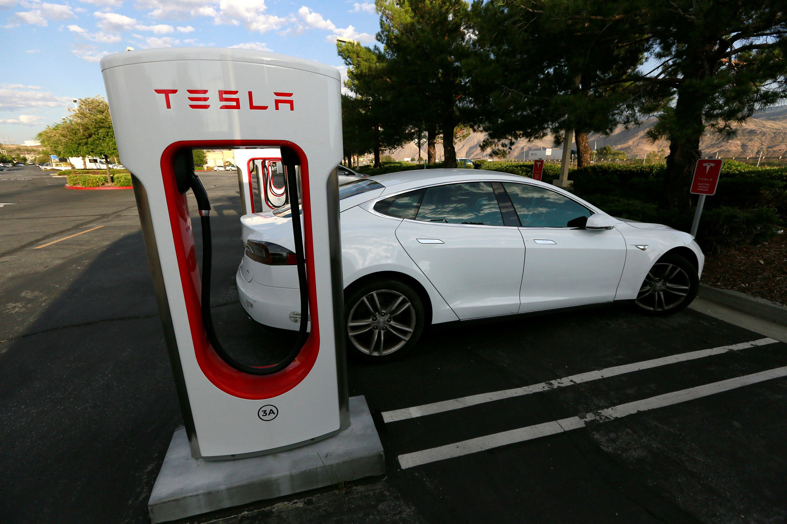 A Tesla Model S charges at a Tesla Supercharger station in Cabazon, Calif., May 18, 2016.