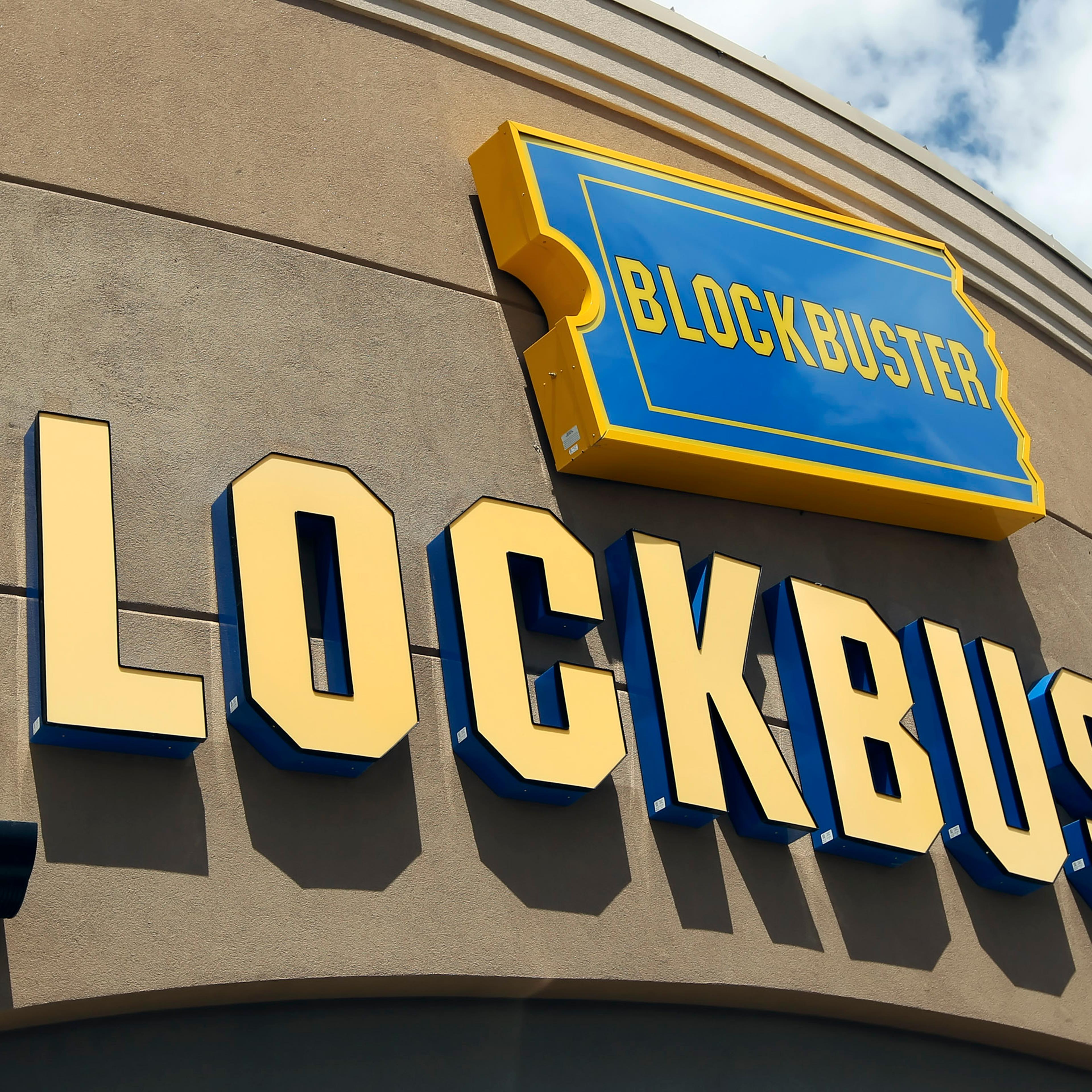 Signage hangs outside a Blockbuster store in Salt Lake City, Utah, U.S., on Wednesday, May 12, 2010.