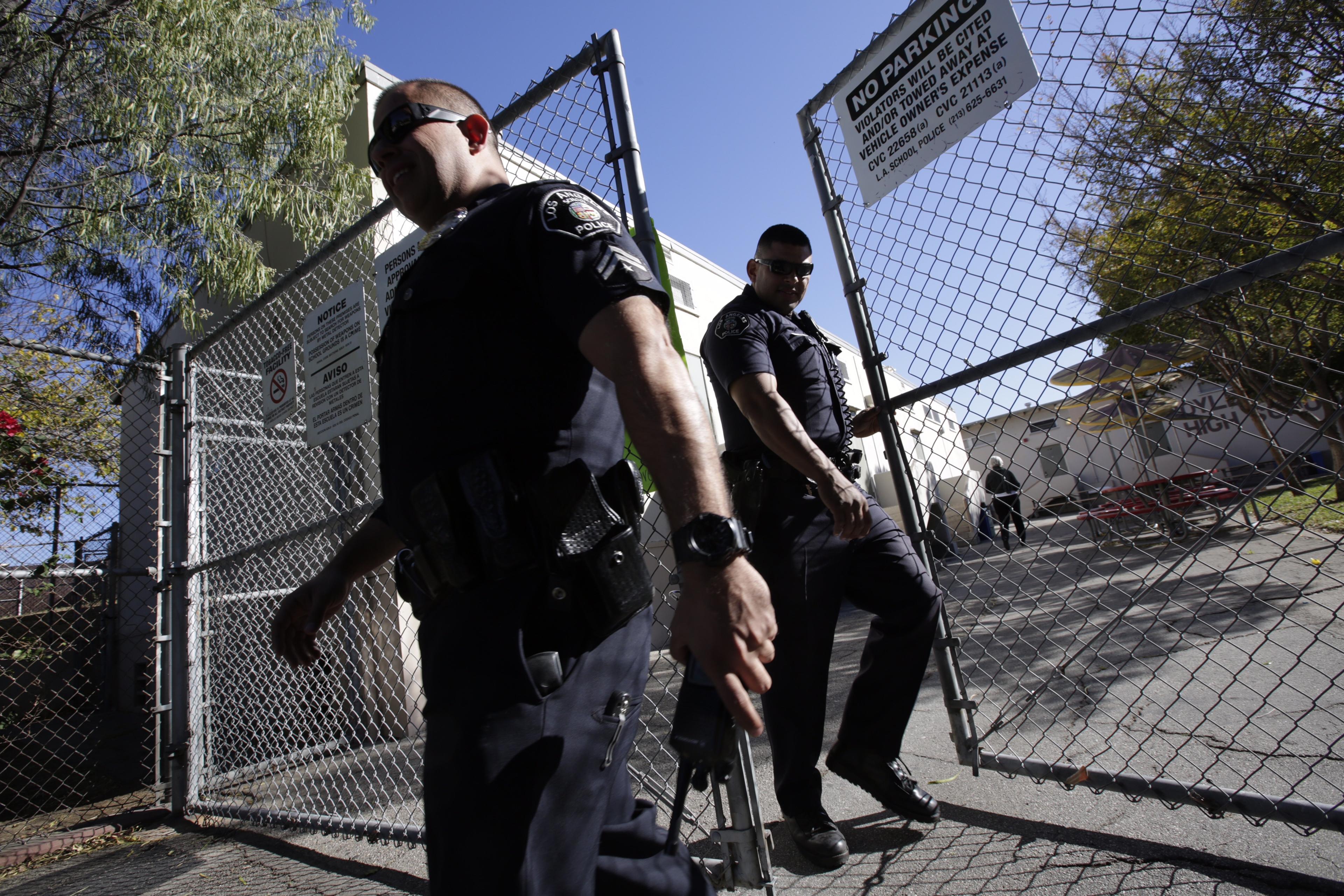 Los Angeles School Police search Theodore Roosevelt High School in the Boyle Heights area of Los Angeles over a threat of violence.