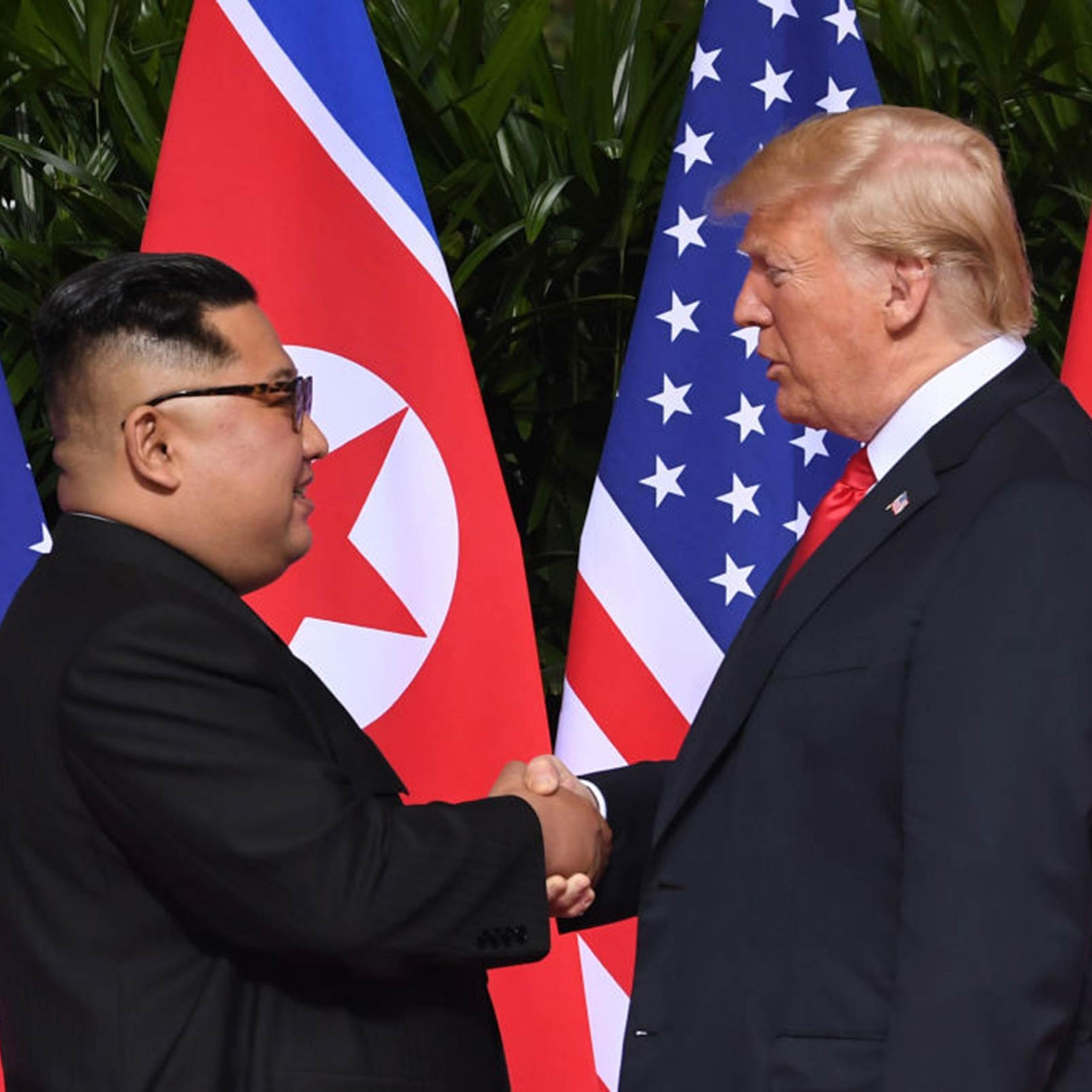The President of the United States Donald Trump and North Korea's leader Kim Jong Un shake hands