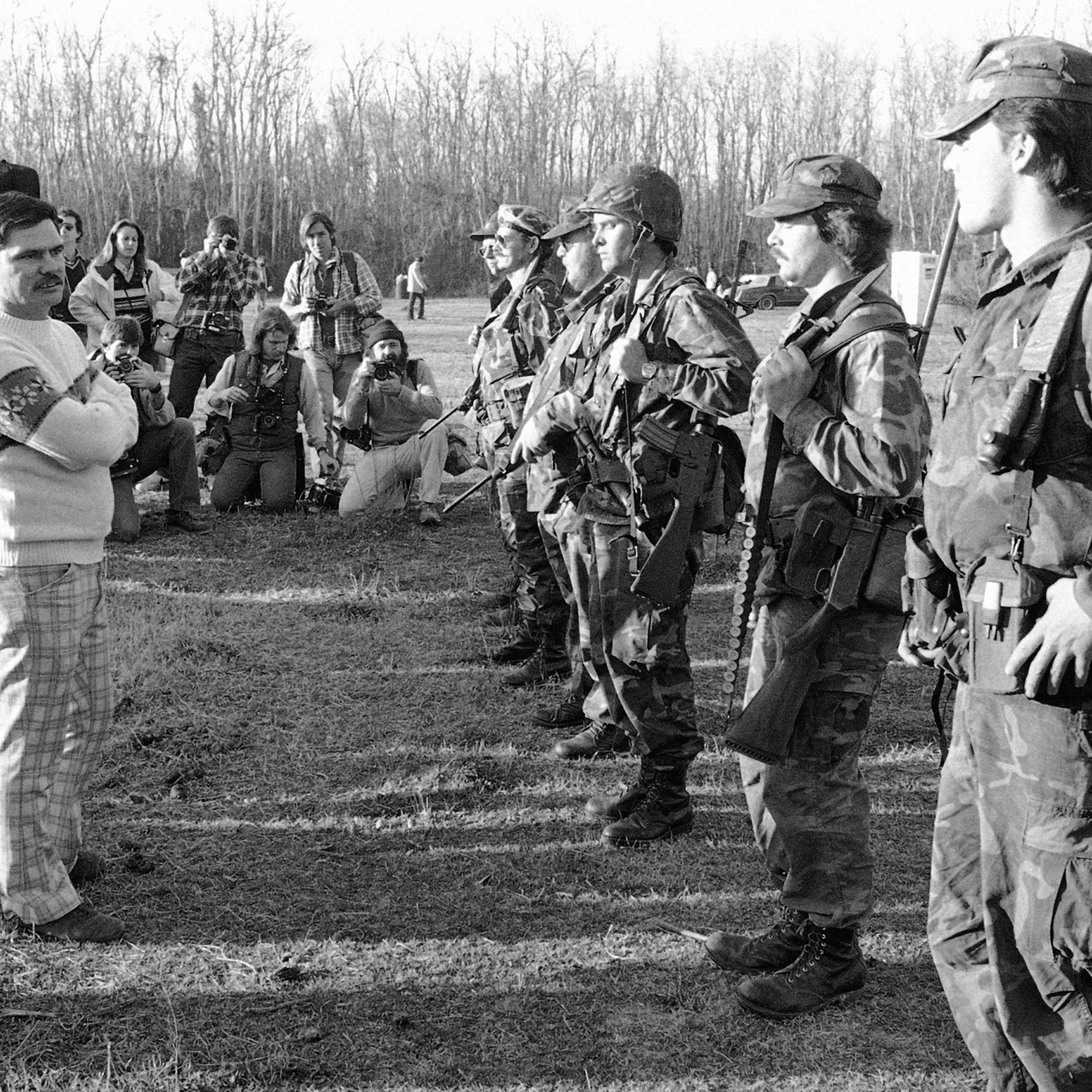 Louis Beam, Grand Dragon of the Texas Realm of the Knights of the Ku Klux Klan, inspecting the security force of the Klan