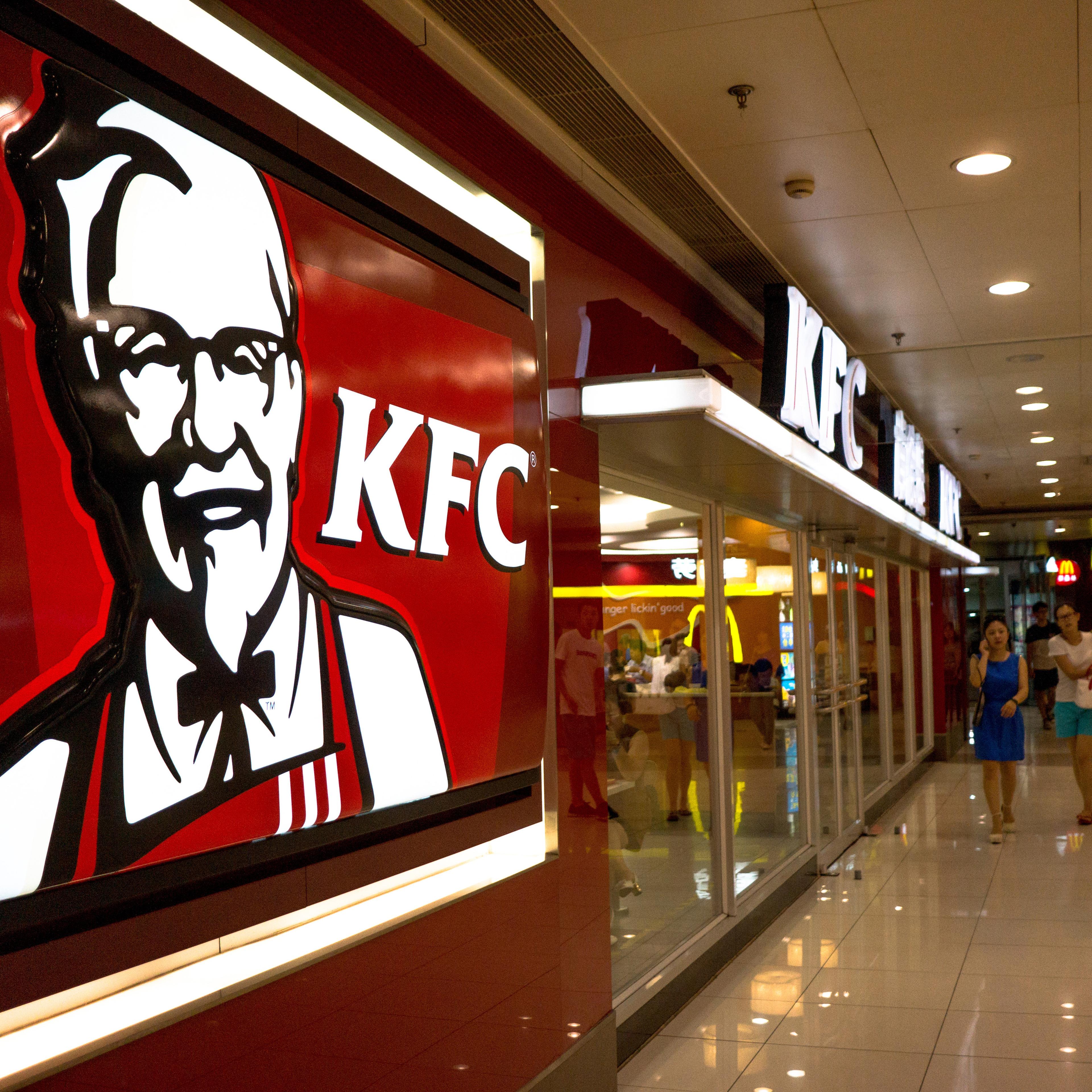 A KFC restaurant in a shopping mall. KFC, McDonalds,