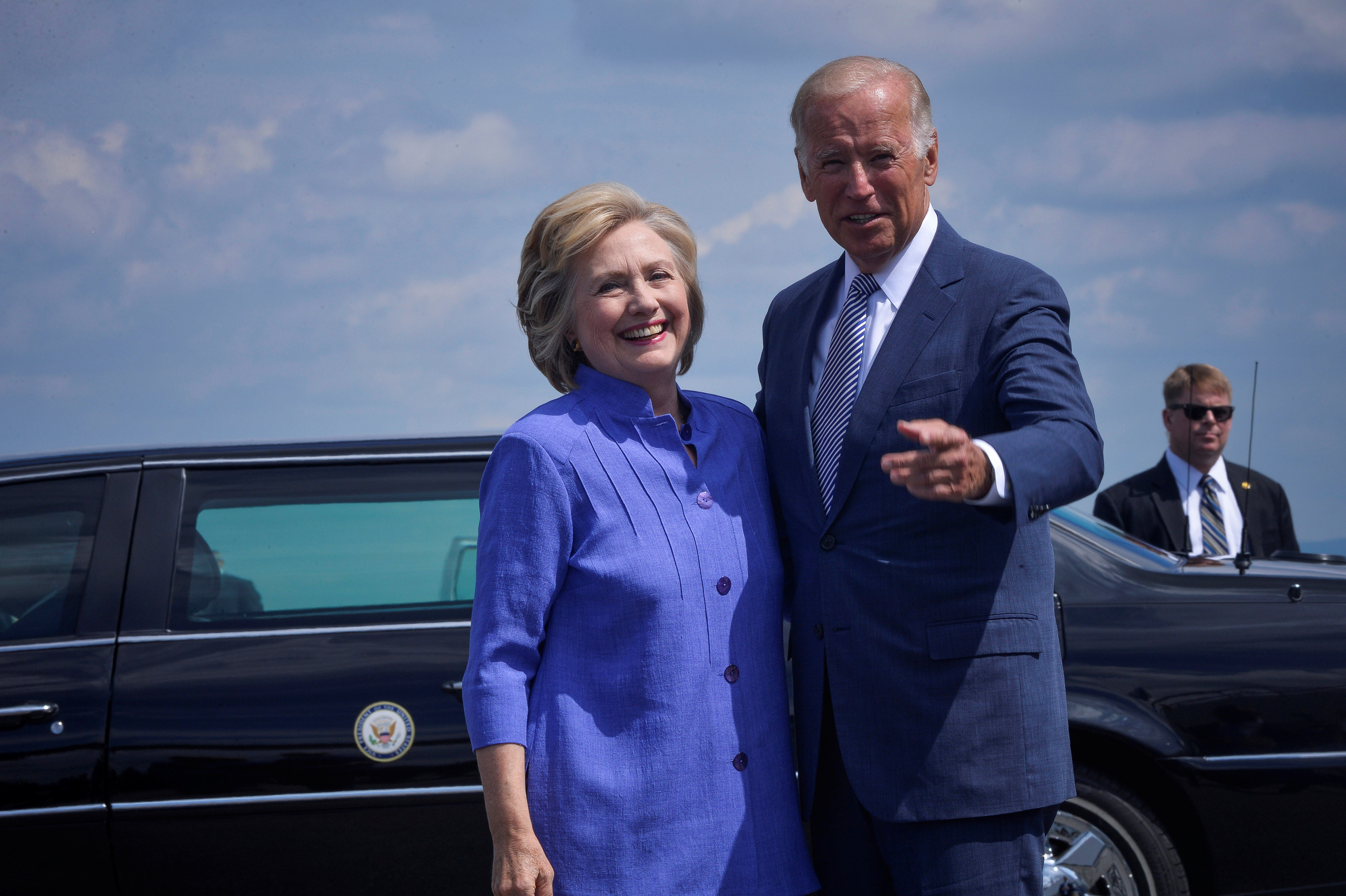 Democratic presidential nominee Hillary Clinton welcomes Vice President Joe Biden as he disembarks from Air Force Two for a joint campaign event in Scranton, Pennsylvania, August 15, 2016. REUTERS/Charles Mostoller - RTX2KZYF