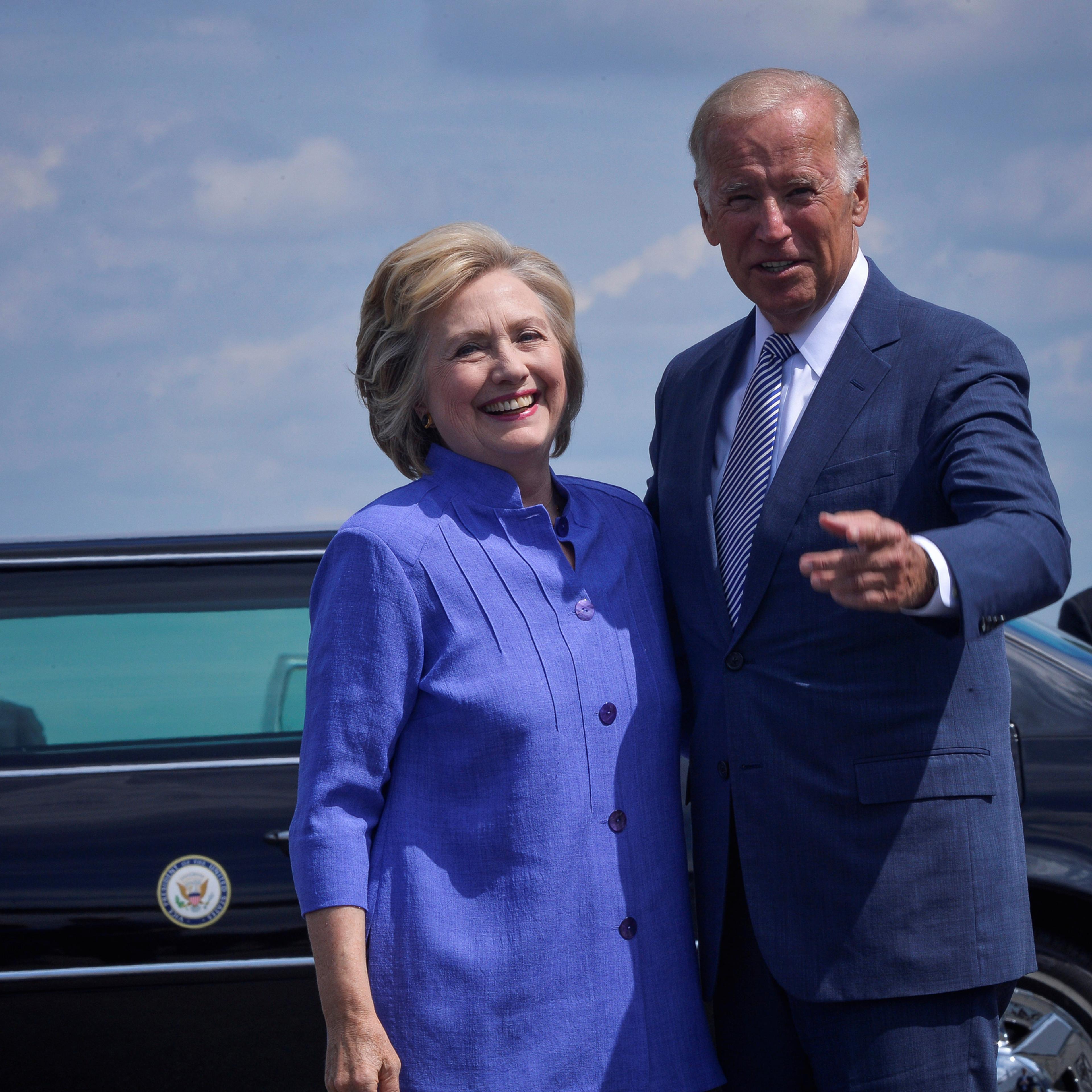 Democratic presidential nominee Hillary Clinton welcomes Vice President Joe Biden as he disembarks from Air Force Two for a joint campaign event in Scranton, Pennsylvania, August 15, 2016. REUTERS/Charles Mostoller - RTX2KZYF
