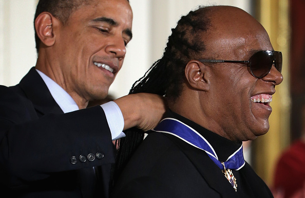 U.S. President Barack Obama (L) presents the Presidential Medal of Freedom to singer songwriter Stevie Wonder (R) during an East Room ceremony at the White House November 24, 2014 in Washington, DC.