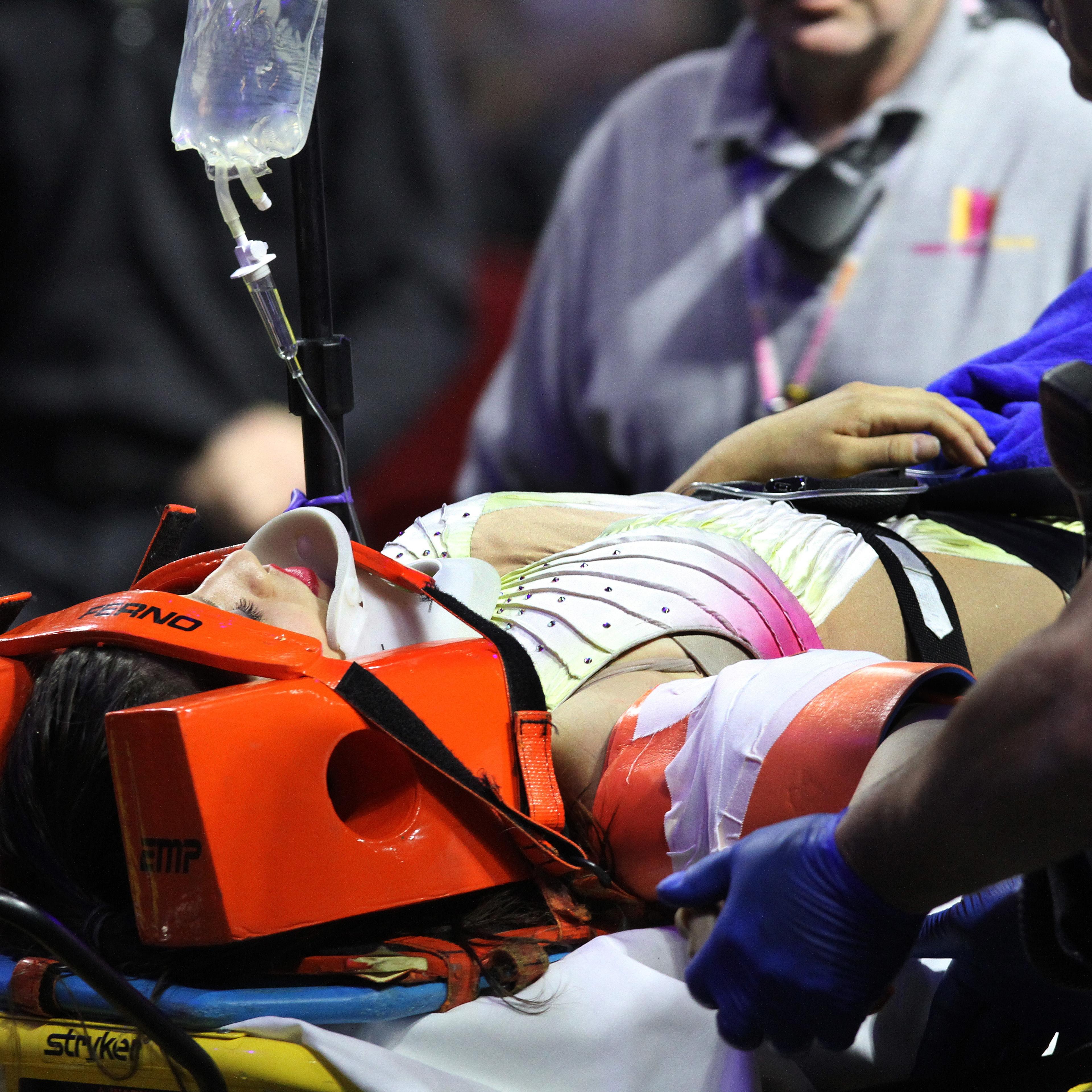 An injured female performer is lifted onto a stretcher and is taken out of the building at the Ringling Brothers and Barnum and Bailey Circus, May 4, 2014, in Providence, R.I.