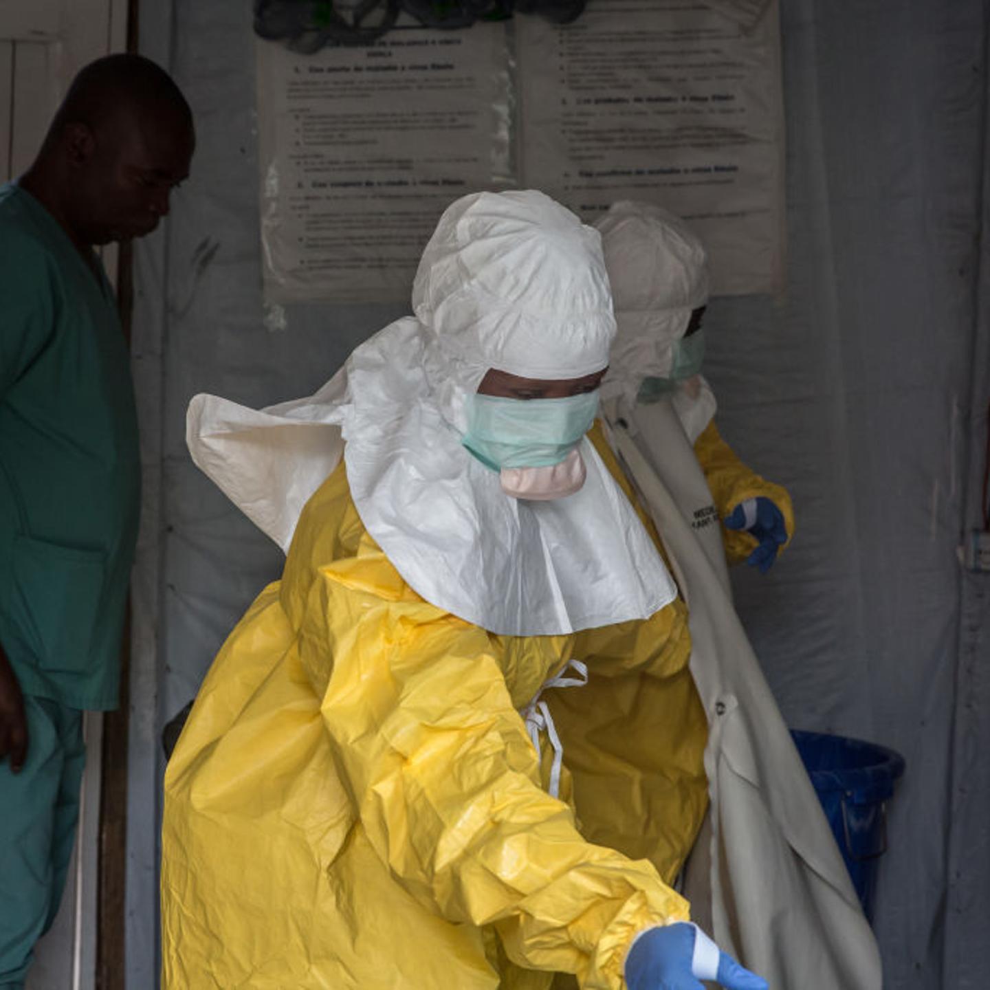 Medical staff dressed in protective gear before entering an