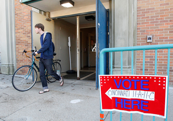 Voters walk out of their precinct after voting as Ohio voters go to the polls for the Ohio primary March 15, 2016, at St George Church in Cincinnati, Ohio.
