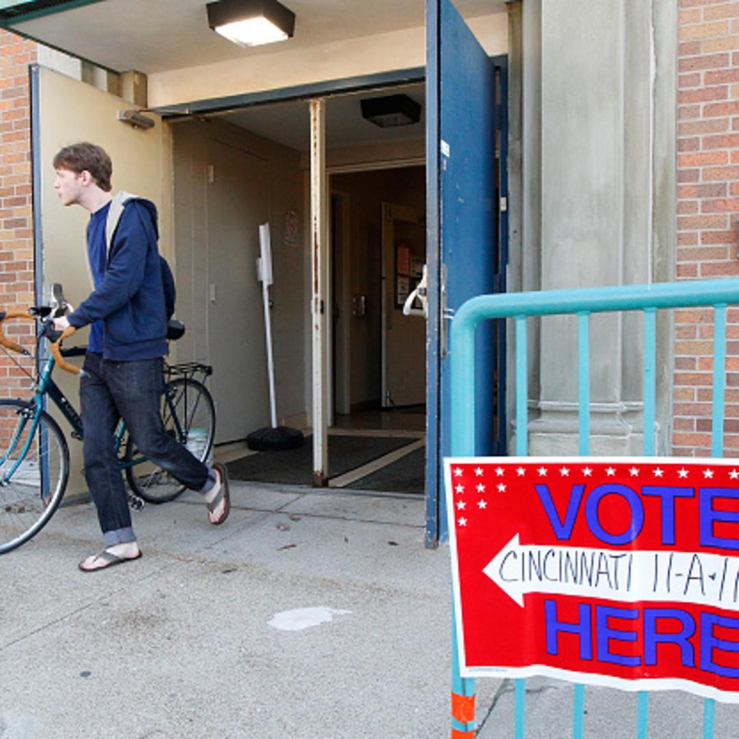 Voters walk out of their precinct after voting as Ohio voters go to the polls for the Ohio primary March 15, 2016, at St George Church in Cincinnati, Ohio.