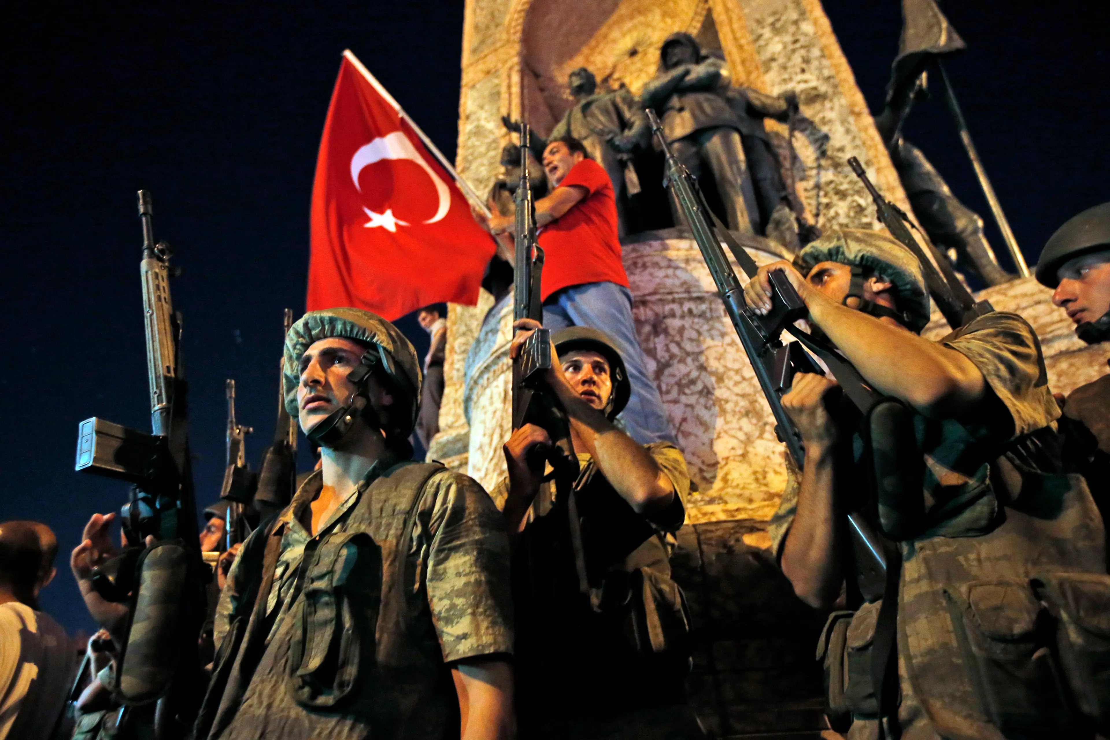 Turkish soldiers secure the area as supporters of President Recep Tayyip Erdogan protest in Istanbul's Taksim Square early on July 16, 2016.