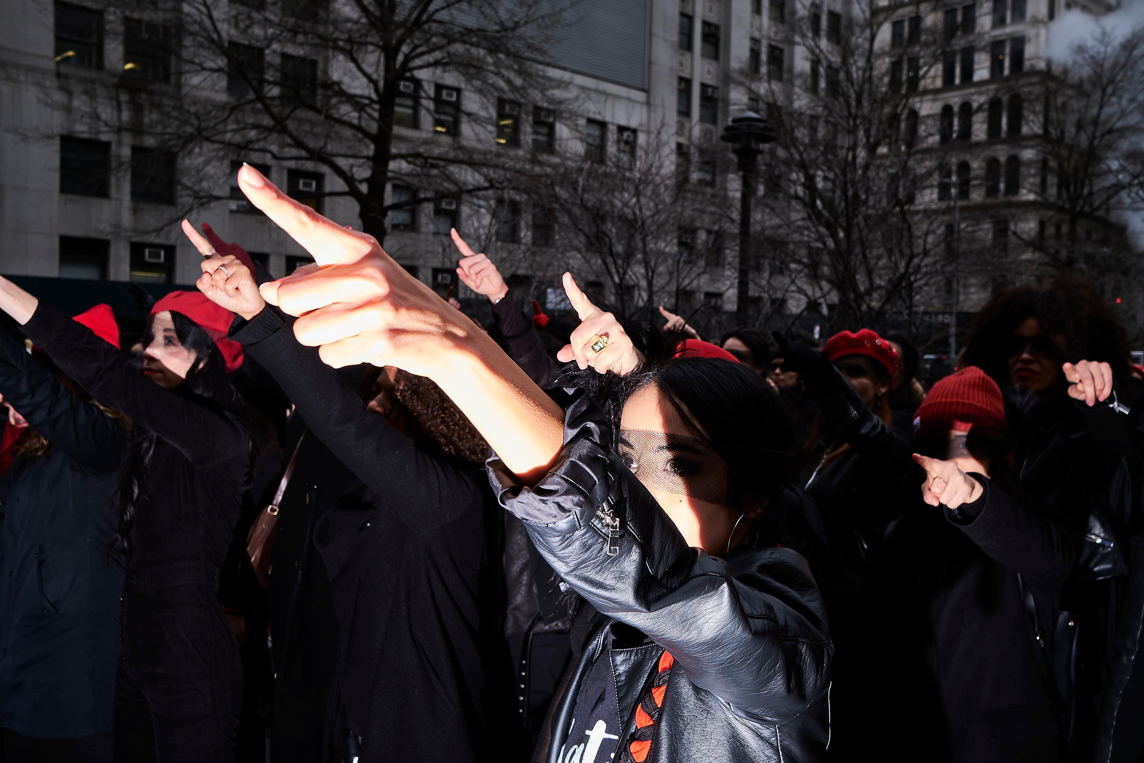 Women inspired by the Chilean feminist group called Las Tesis perform "the rape dance" in front of the New York City criminal court during Harvey Weinstein rape trial on January 10, 2020 in Manhattan, NYC.