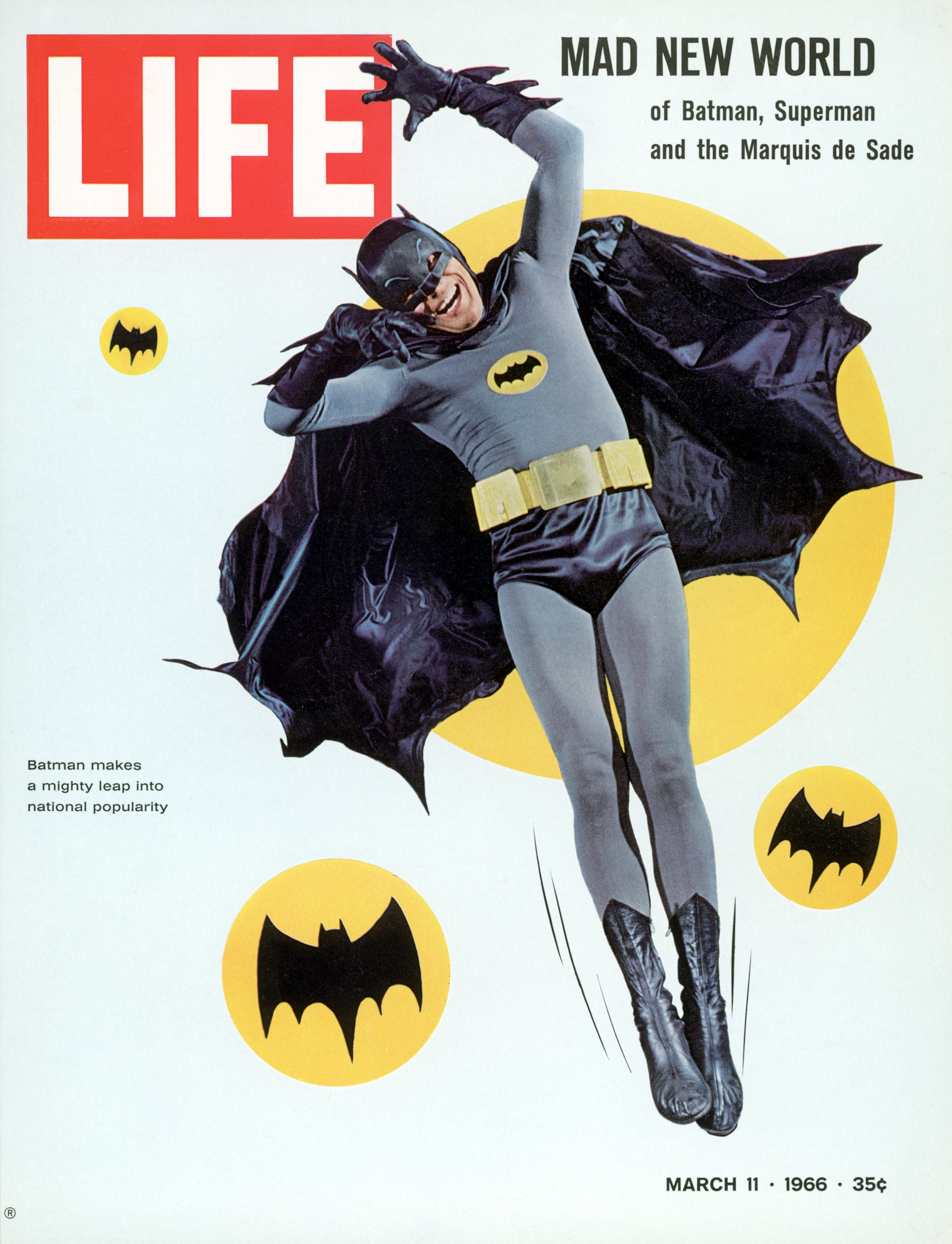 Adam West strikes a hammy pose as superhero Batman in 1966.