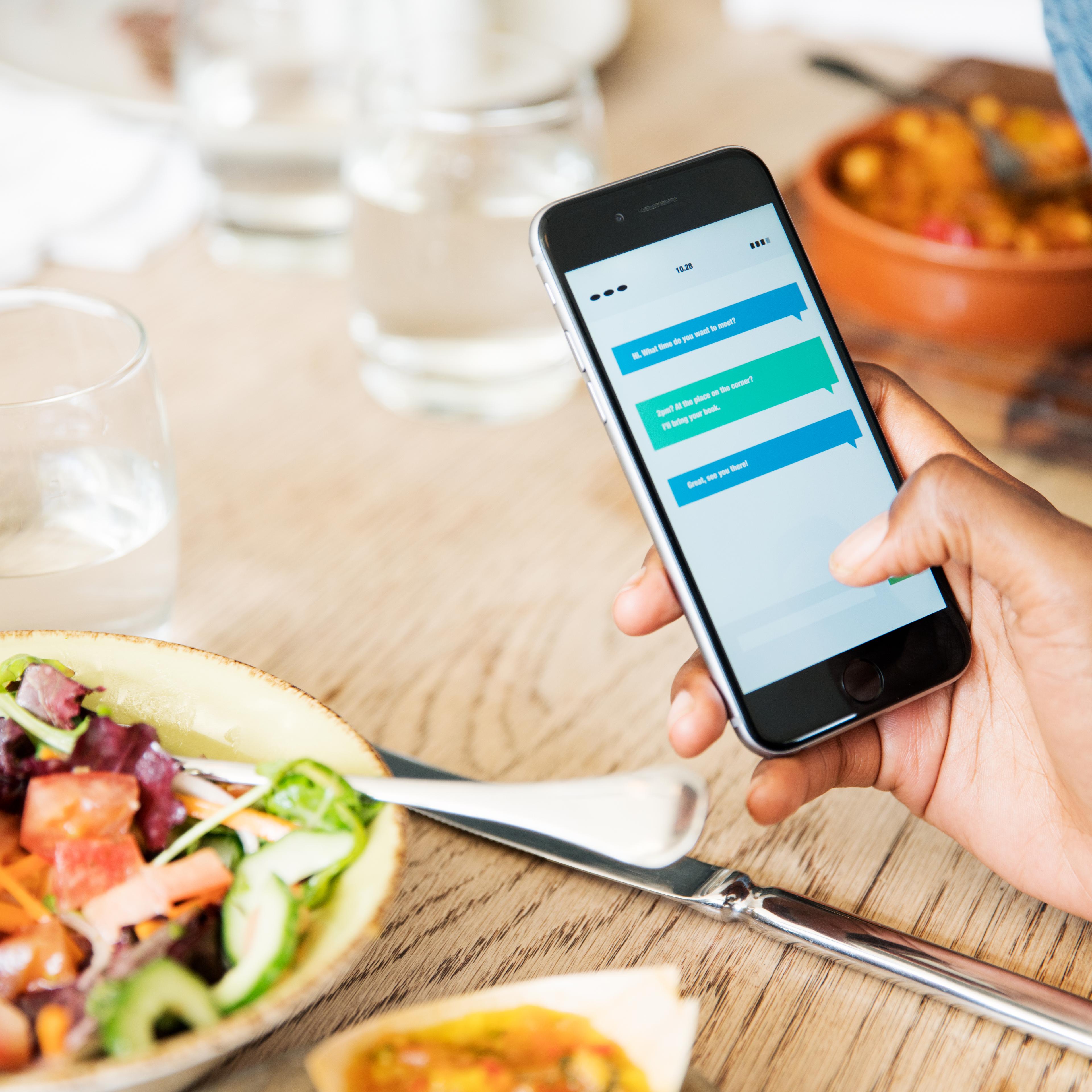 Close up of smart phone at lunch