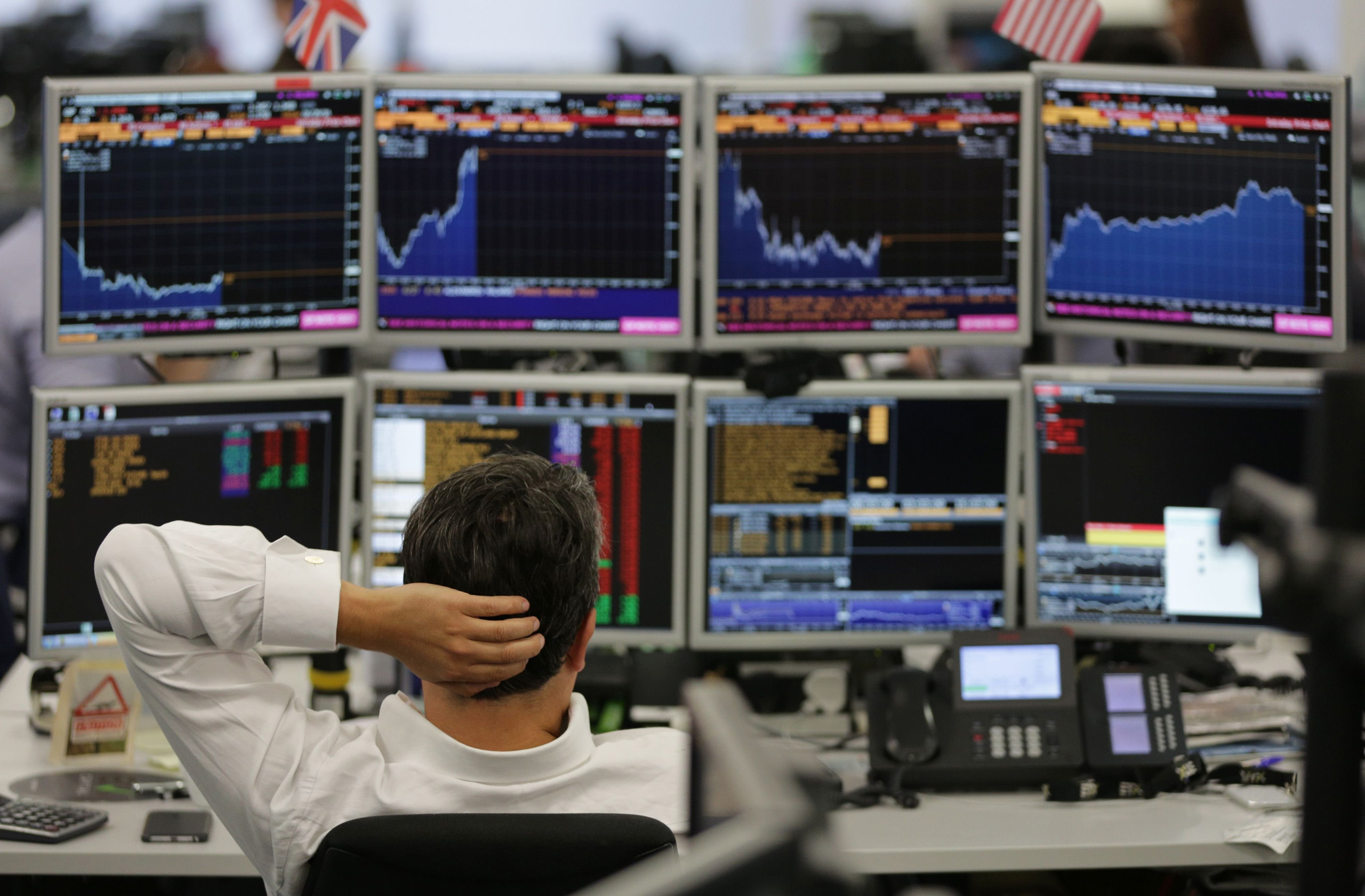 Traders from ETX Capital work in central London on June 27, 2016.