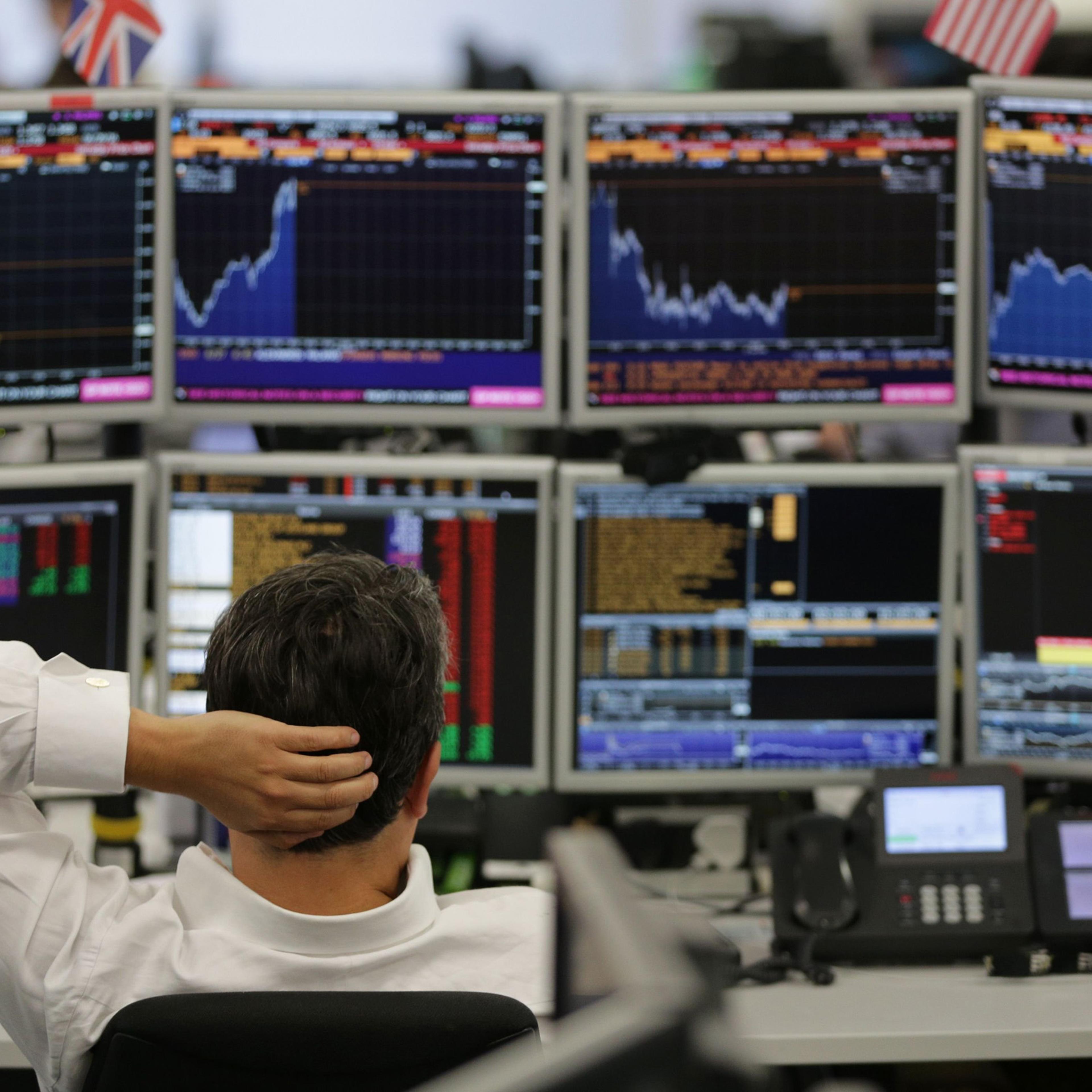 Traders from ETX Capital work in central London on June 27, 2016.