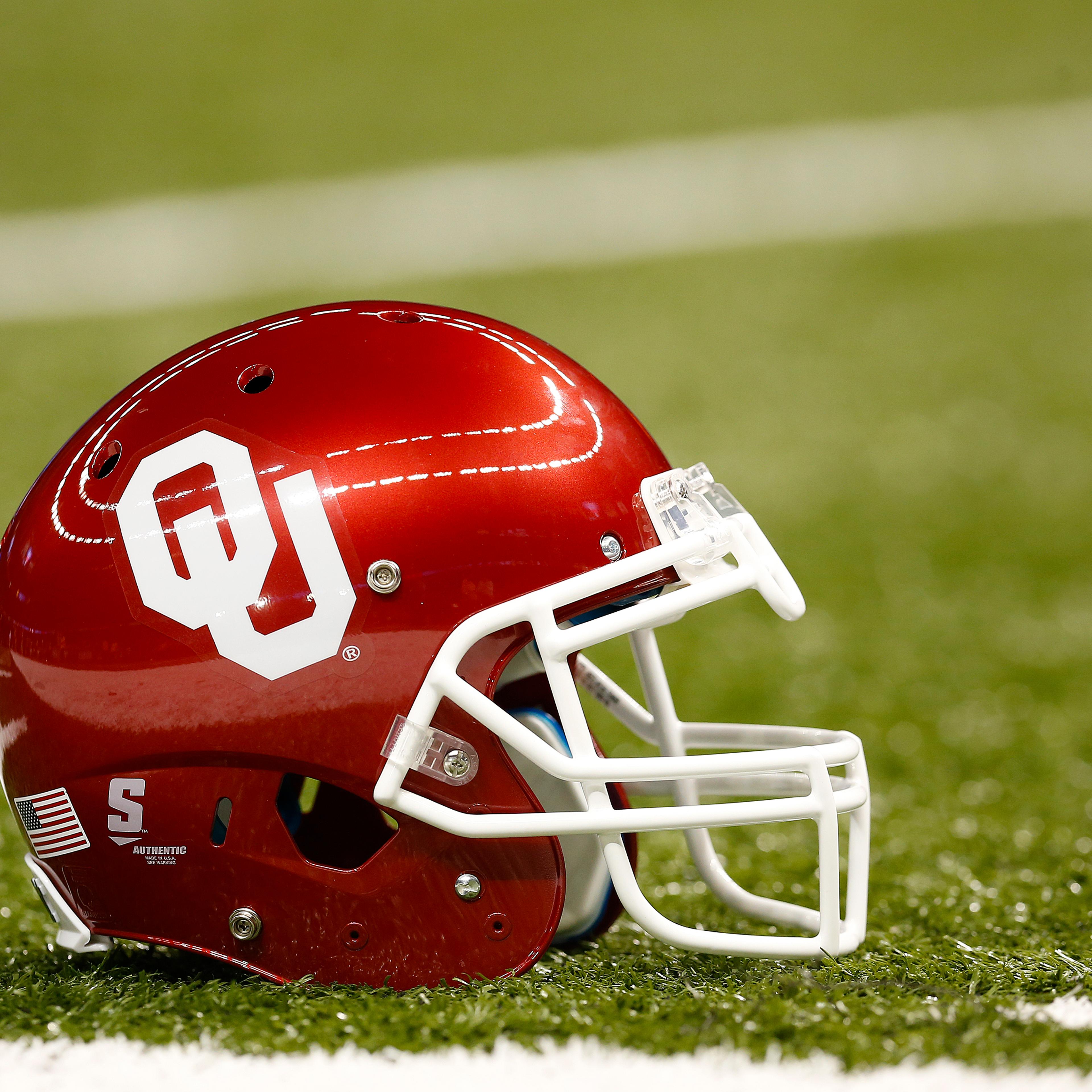 University of Oklahoma Sooners helmet is seen on the field a game against the University of Alabama Crimson Tide in New Orleans on Jan. 2, 2014.
