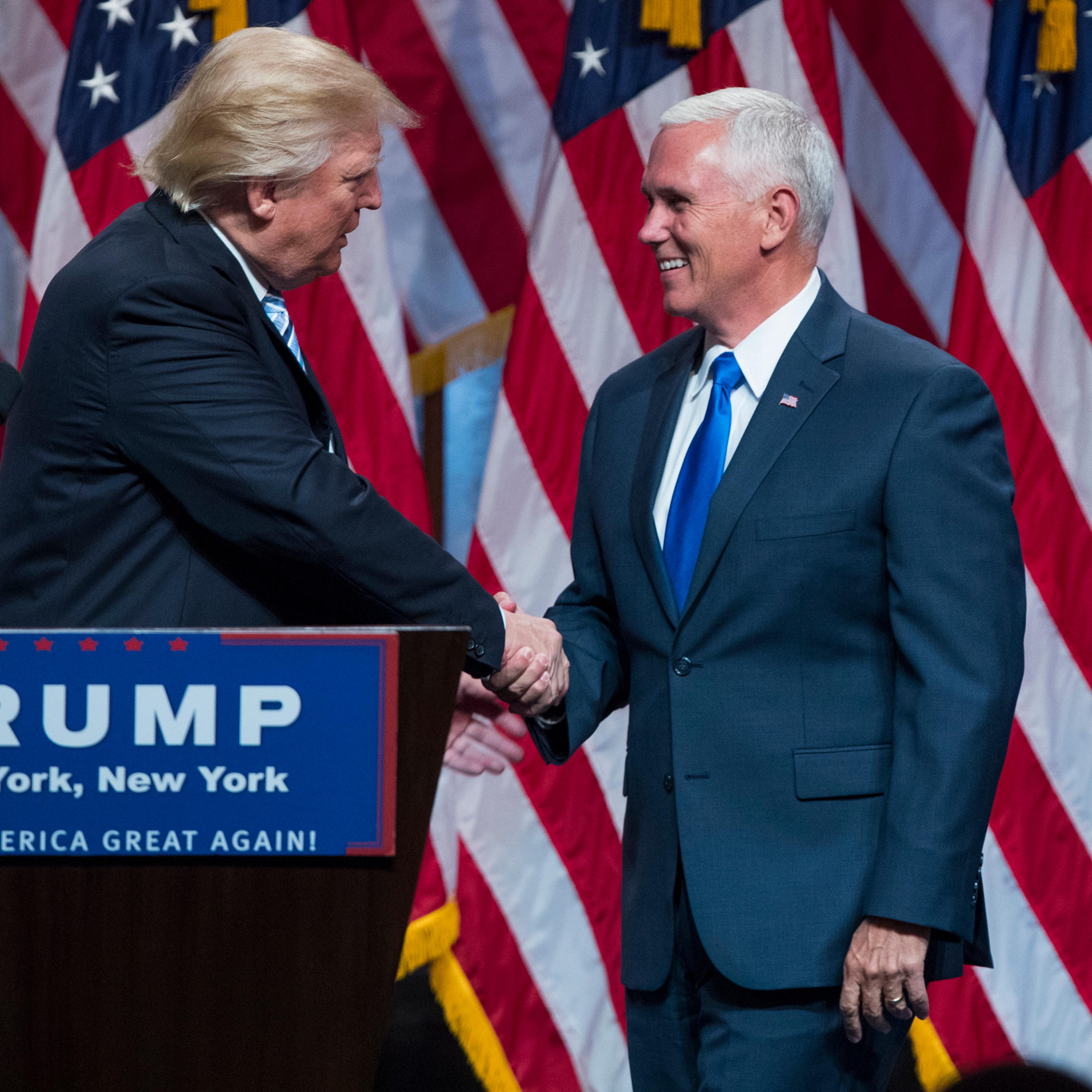 Republican presidential candidate Donald Trump, right, introduces Gov. Mike Pence, R-Ind., during a campaign event to announce Pence as the vice presidential running mate in New York City on July 16, 2016.