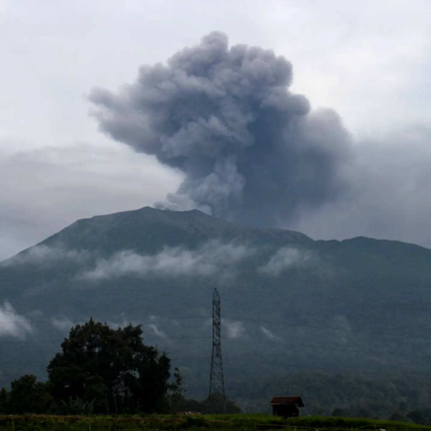 Volcanic ash spews from Mount Marapi during an eruption as seen from Batu Palano village in Agam on Dec. 4, 2023.