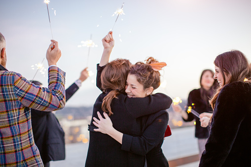 friends-hugging-celebrating