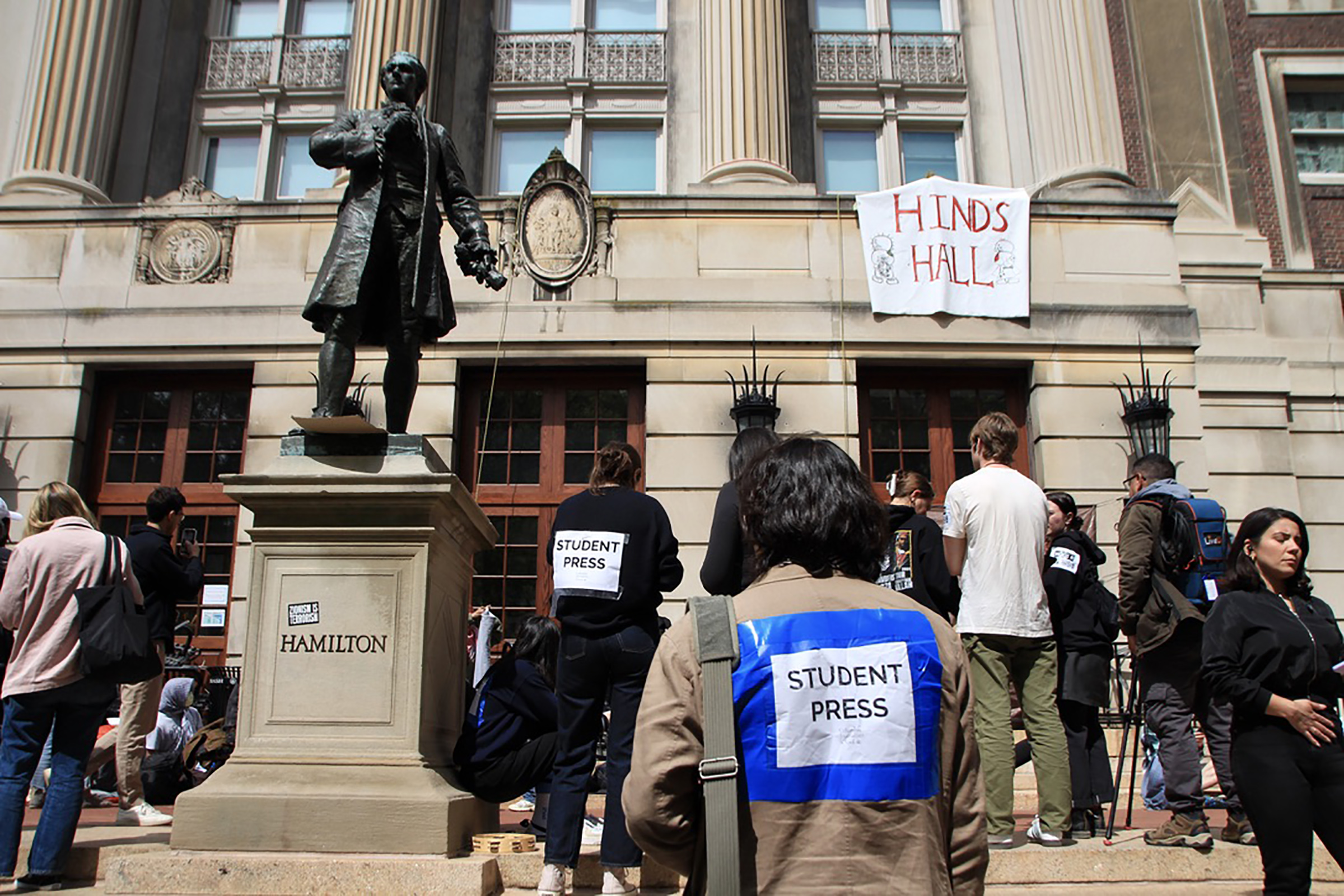 Student reporters gather outside Hamilton Hall on the Columbia University campus the day after protestors occupied the building.