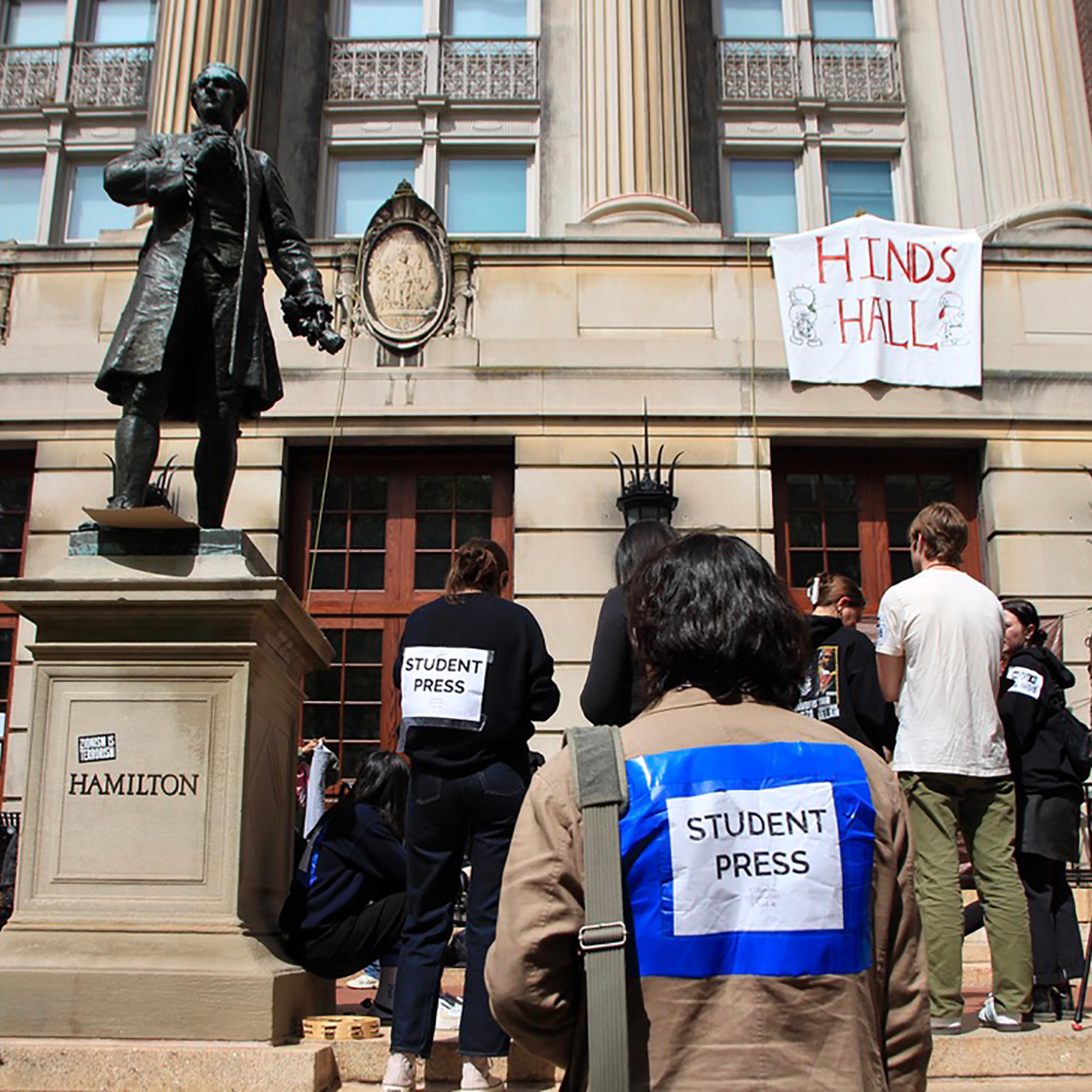 Student reporters gather outside Hamilton Hall on the Columbia University campus the day after protestors occupied the building.