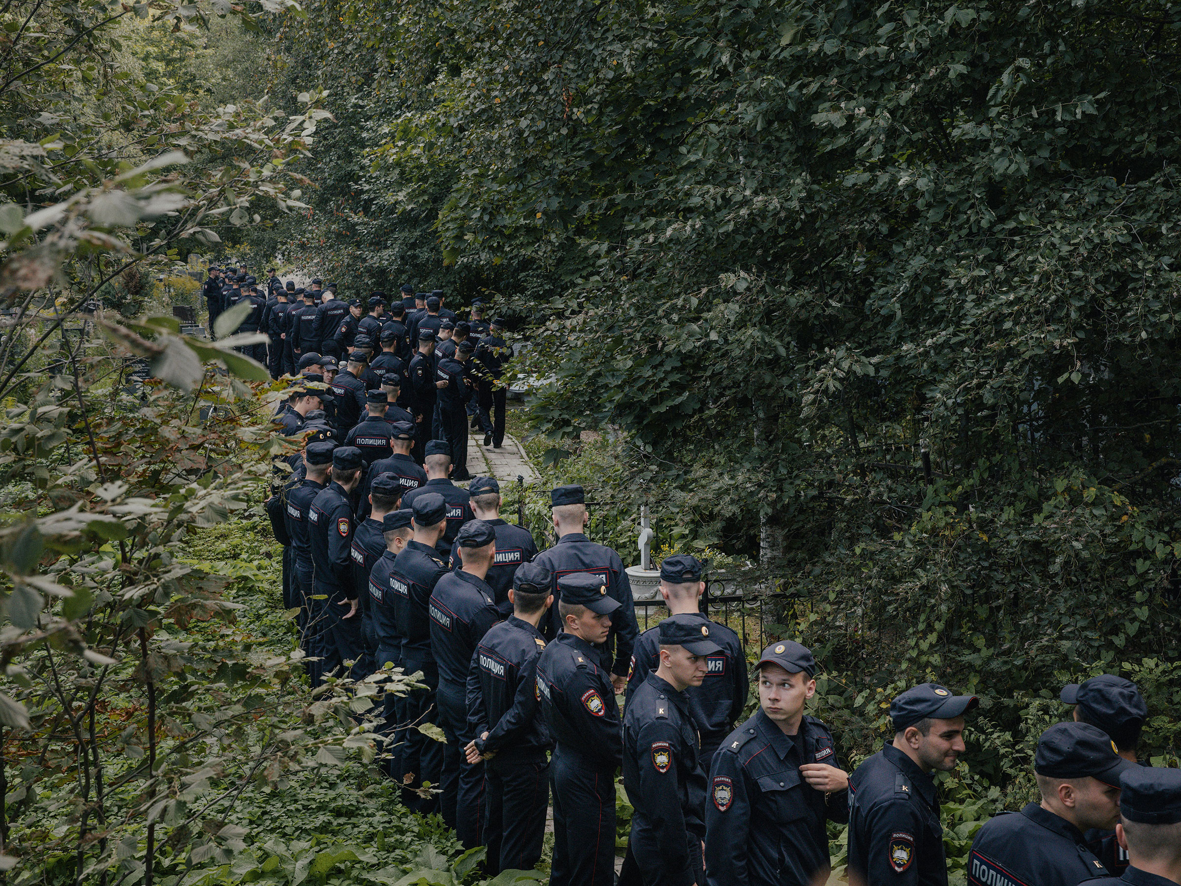 Police officers at the Porokhovskoye cemetery, where the press service owned by Yevgeny Prigozhin said he was buried Tuesday, in St. Petersburg, Russia, Aug. 29, 2023