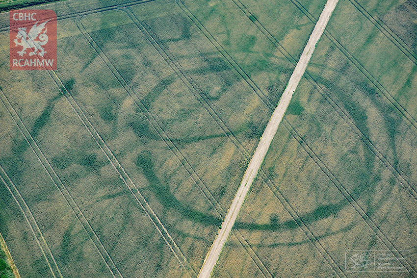 A large prehistoric circular structure in Wales revealed by hot weather. Surveyors think the hot weather has revealed traces of a Roman villa within.